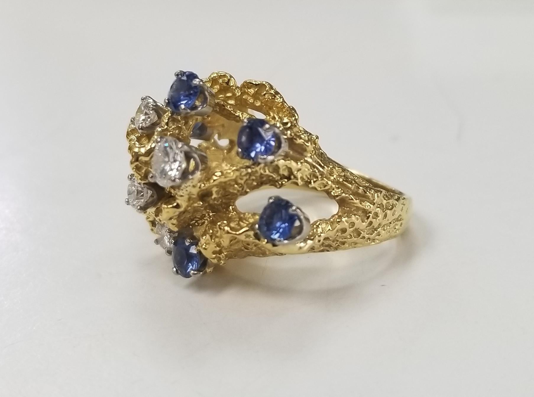 1950's 18k yellow gold diamond and sapphire free form ring, containing 5 round full cut diamonds of very fine quality weighing .60pts. and 6 round gem quality blue sapphires weighing 1.10ct.s  ring is a size 5.75 and can be sized to fit for free.
