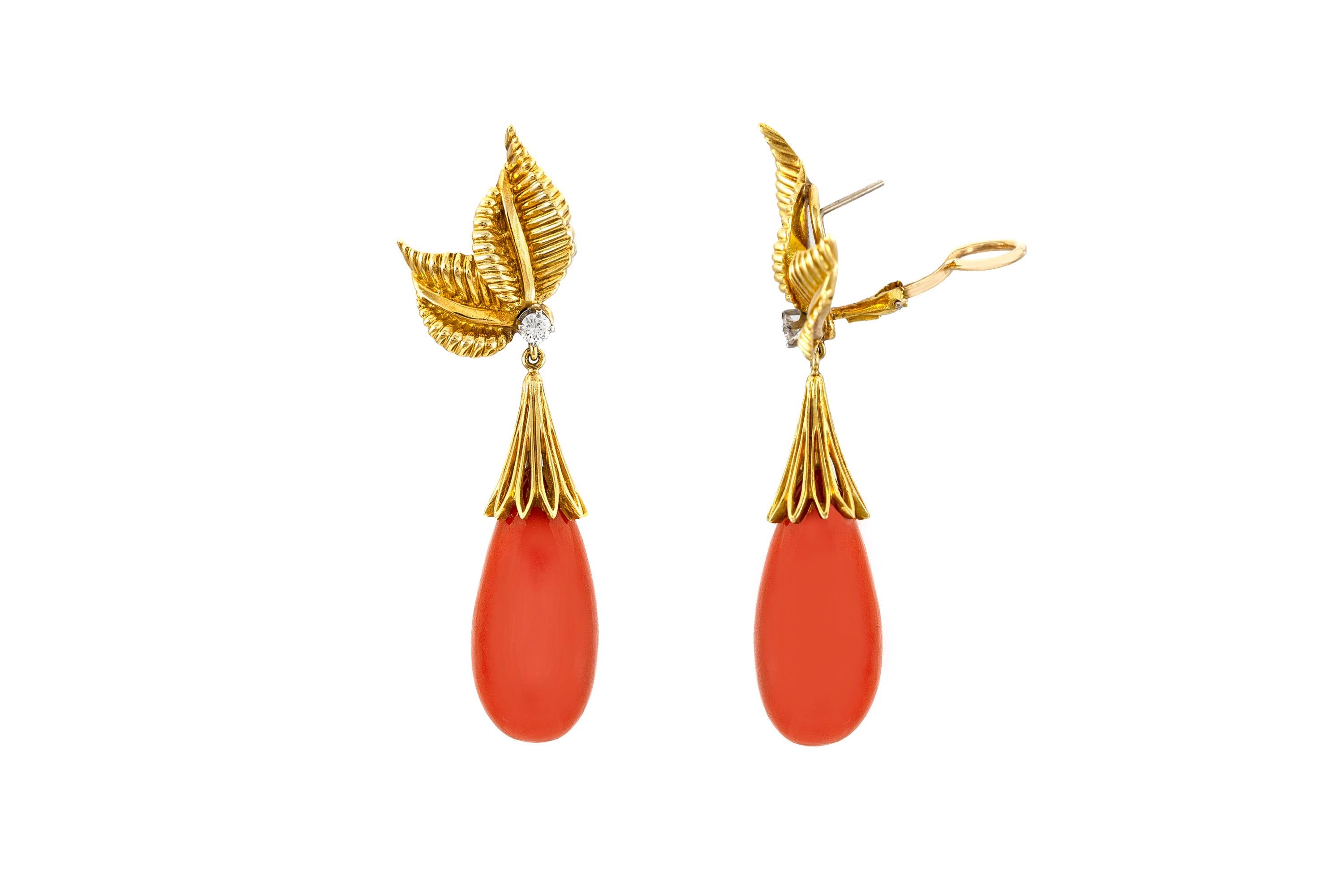 The earrings are finely crafted in 18k yellow gold With two small diamonds weighing approximately total of 0.20 carat and two drop coral.
Circa 1950.
