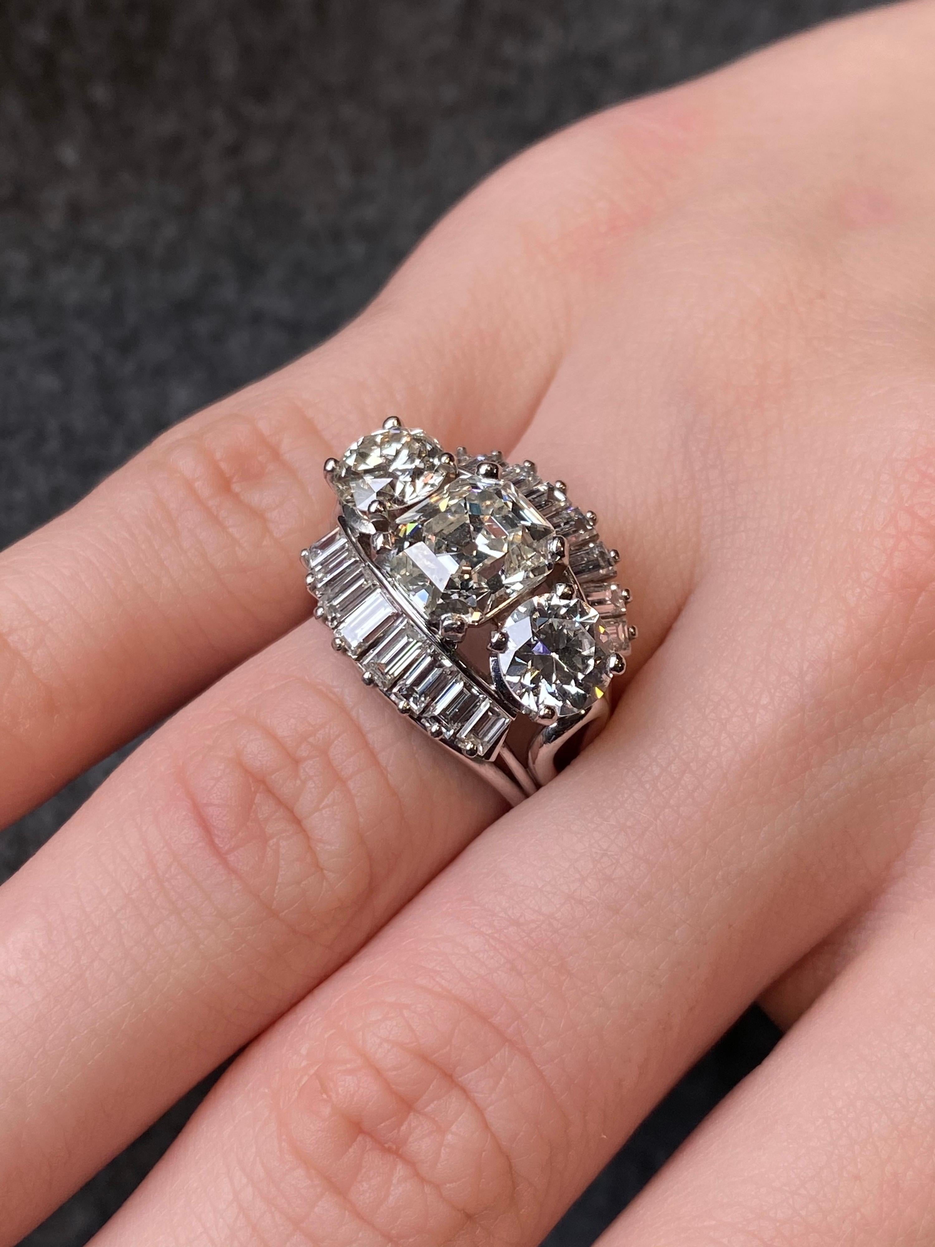 Emerald Cut 1950s-1960s 7 Carat Three-Stone Emerald Round Diamond Ballerina Engagement Ring