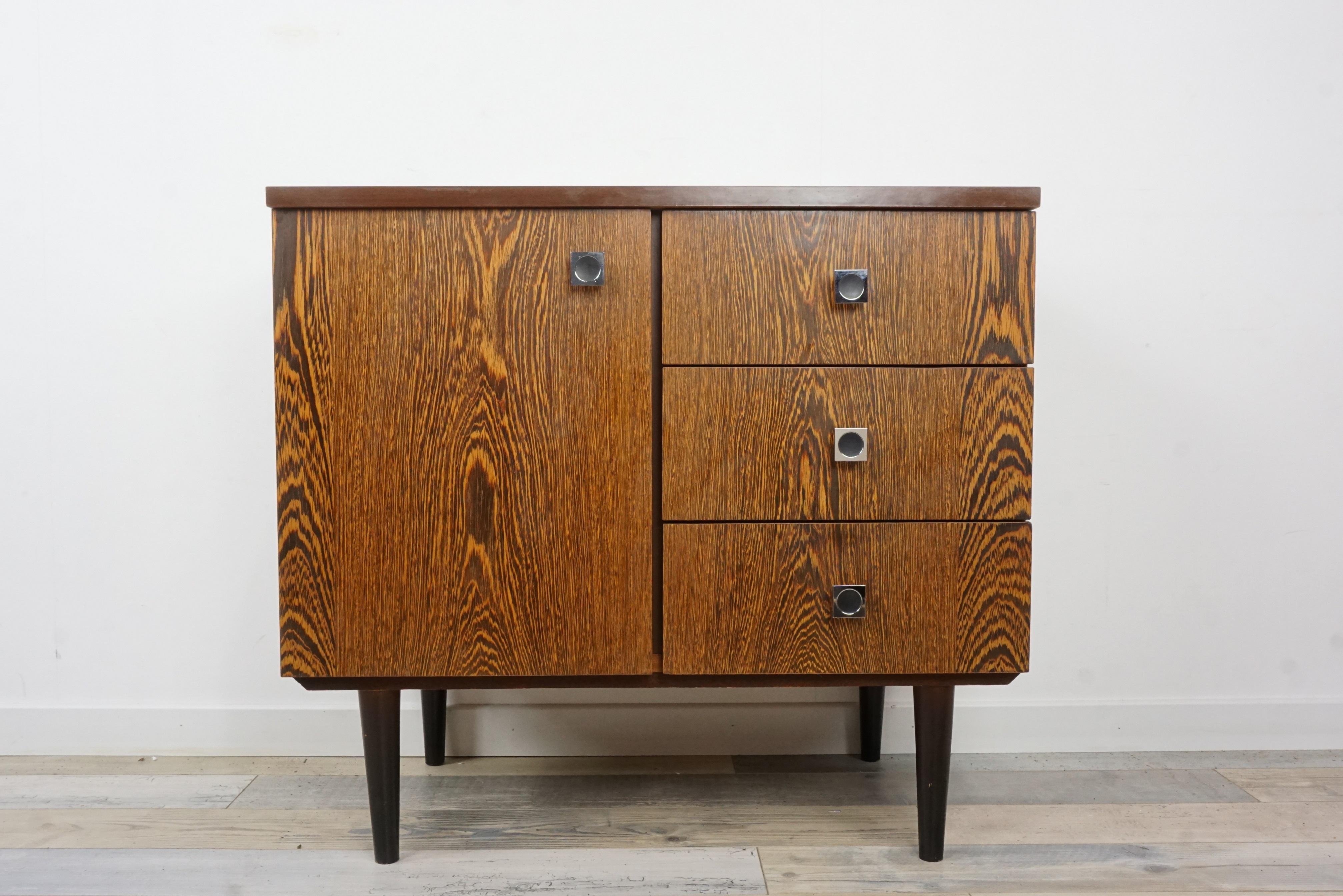 1950s-1960s Wengé wooden cabinet composed of a wooden structure with Minimalist and sober lines, chrome and black metal square handles and compass feet ; harmonious design and practical.