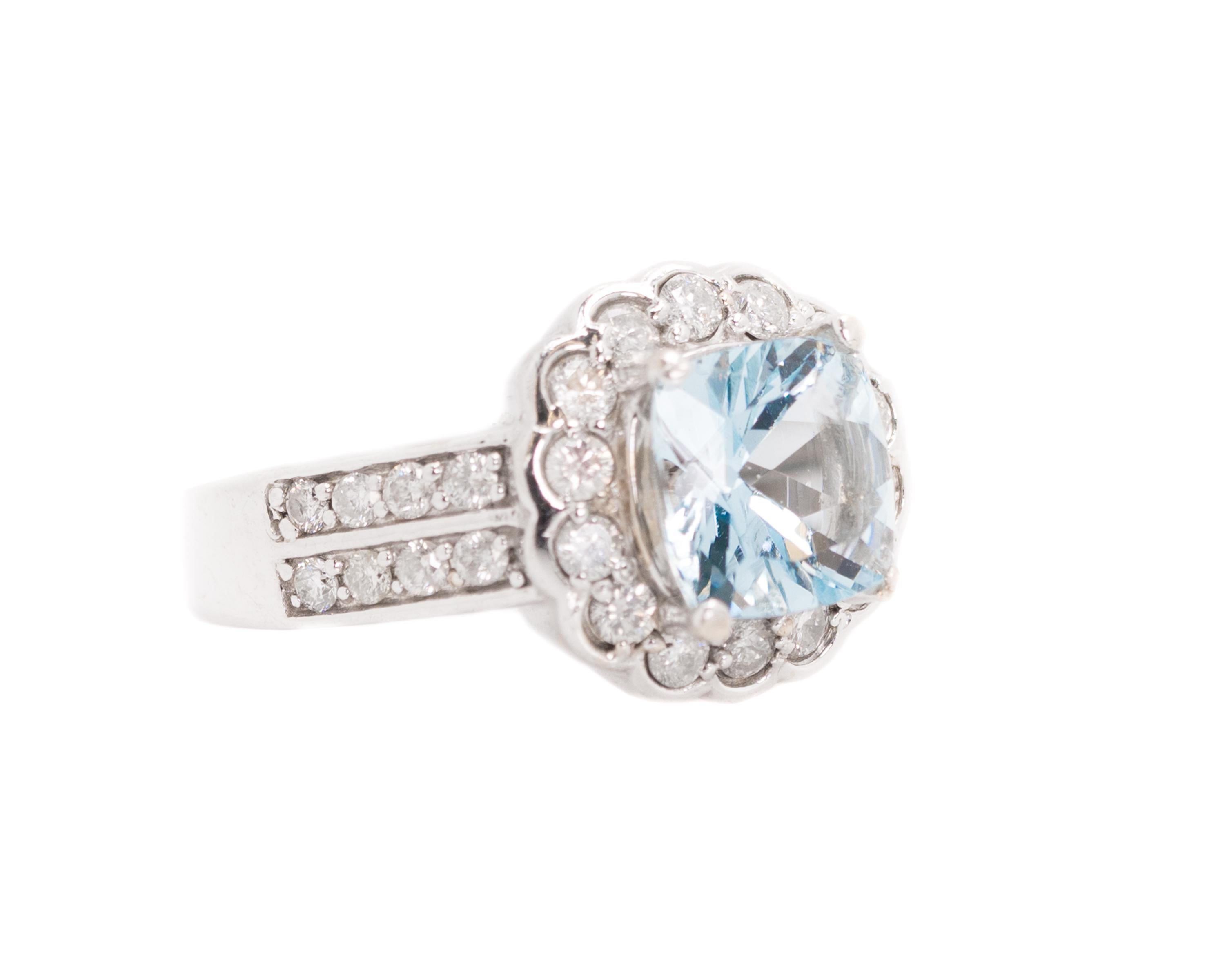 1950s Retro Aquamarine, Diamond Halo Ring - 14k White Gold, Aquamarine, Diamonds

Features:
2.0 carat Cushion cut Aquamarine
2.0 carat total weight Round Brilliant Diamonds
Diamond Floral Petal Halo
Shoulders set with 2 rows of Diamonds
all Stones