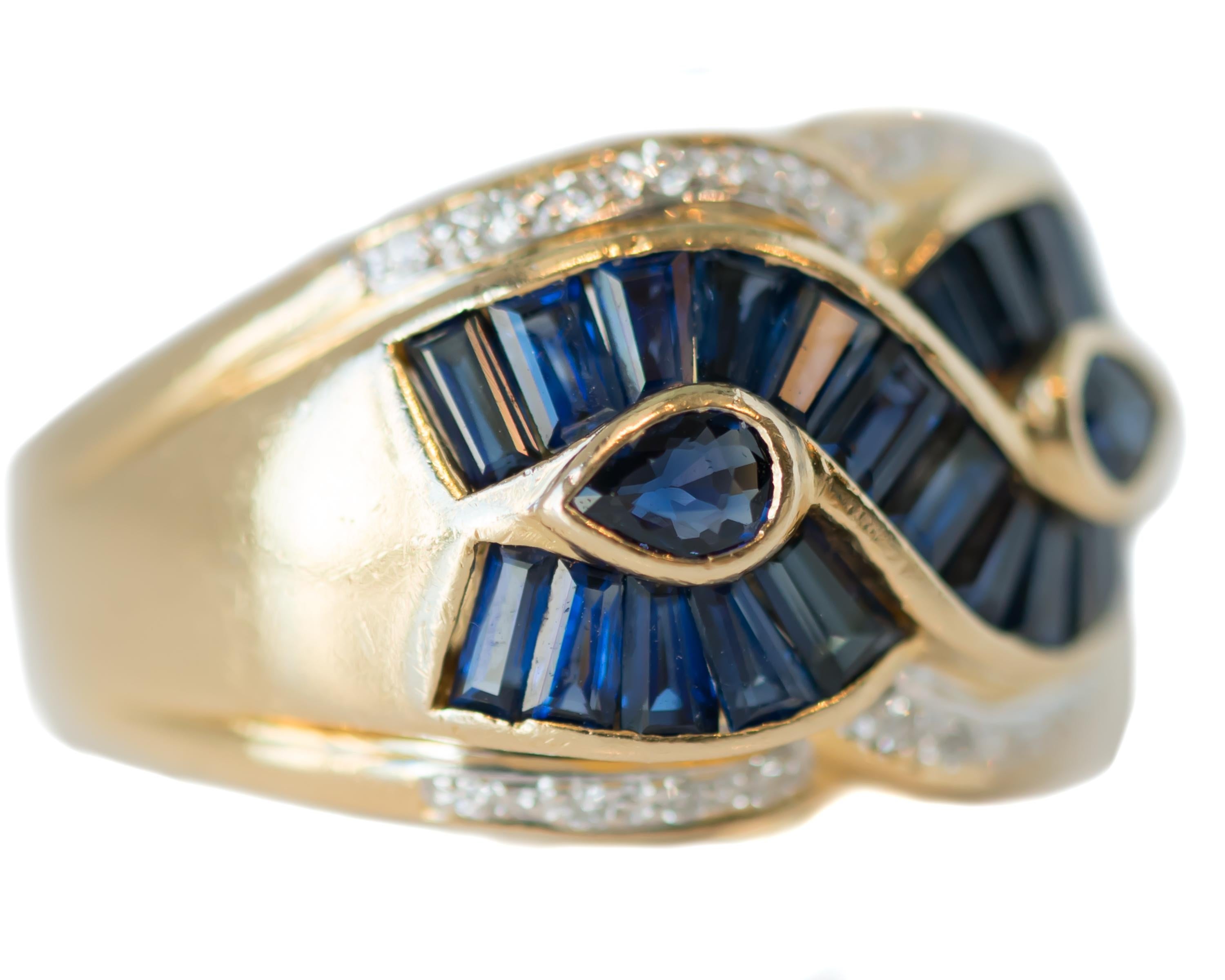 1950s Sapphire and Diamond Gold Band Ring - 18 Karat Yellow Gold, Sapphires, Diamonds

Features:
2.0 carat total Blue Sapphires
0.25 carat total Diamonds
18 Karat Yellow Gold Setting
Modified Bypass Design
Blue Sapphire Baguettes
2 Pear Shaped Blue