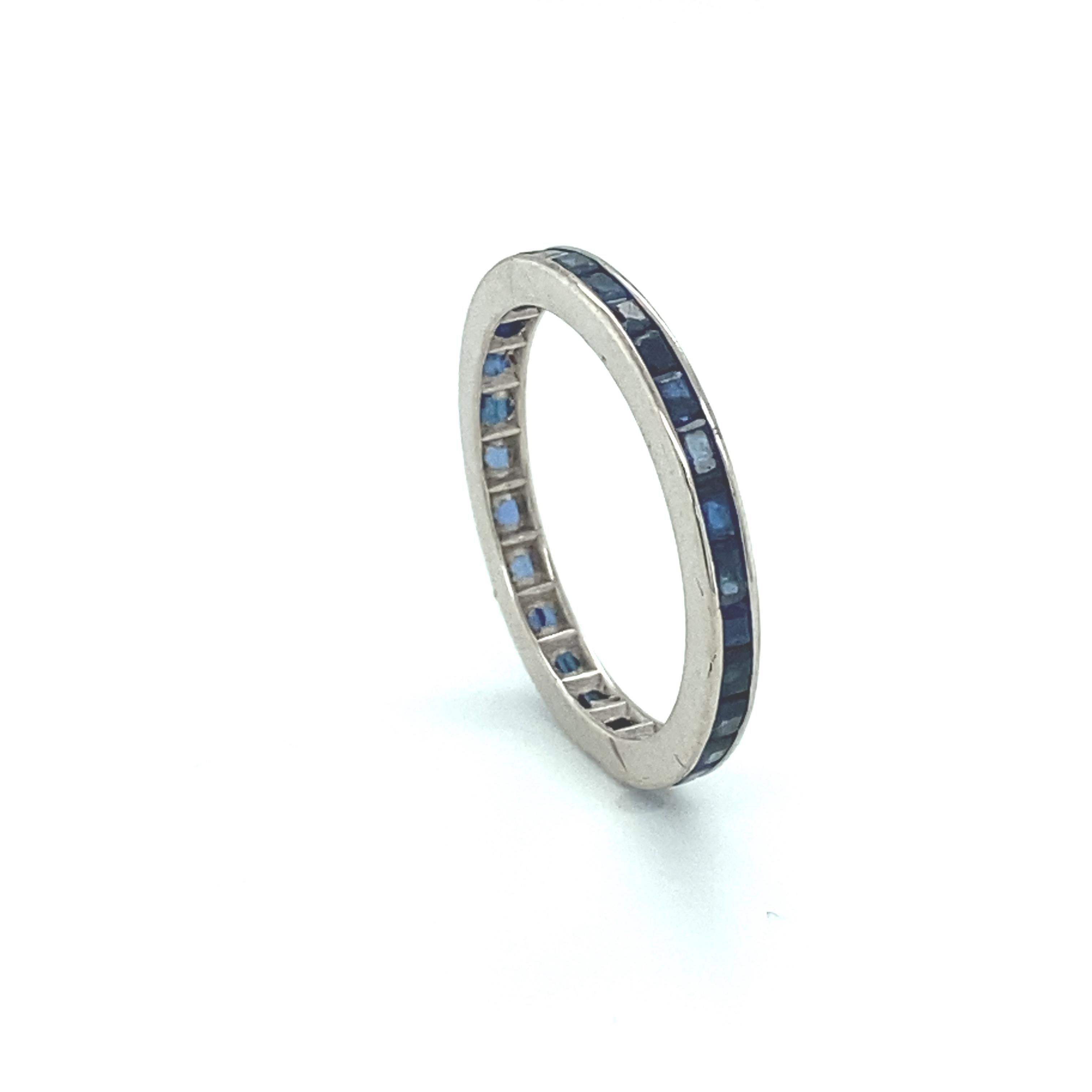 Item Details:
Metal Type: 14 Karat White Gold
Weight: 1.6 grams
Size: 7 (not resizable)

Sapphire Details:
Carat: 2 Carat Total
Cut: Baguette Cut
Color: Royal Blue

Made in 1950s
Bezel Set
Beautiful Contrast between Blue Sapphires and 14 Karat White