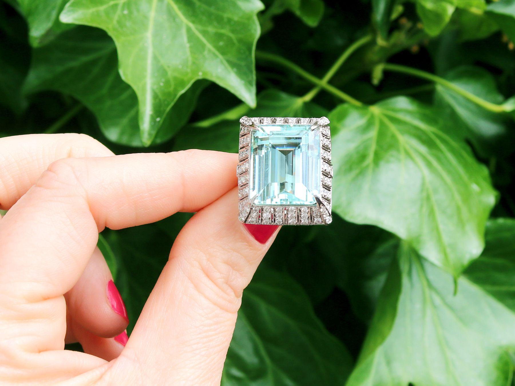 A stunning, fine and impressive vintage 20.50 carat aquamarine, 2.15 carat diamond and platinum dress ring; part of our diverse antique jewelry and estate jewelry collections.

This stunning, fine and impressive vintage emerald cut aquamarine and