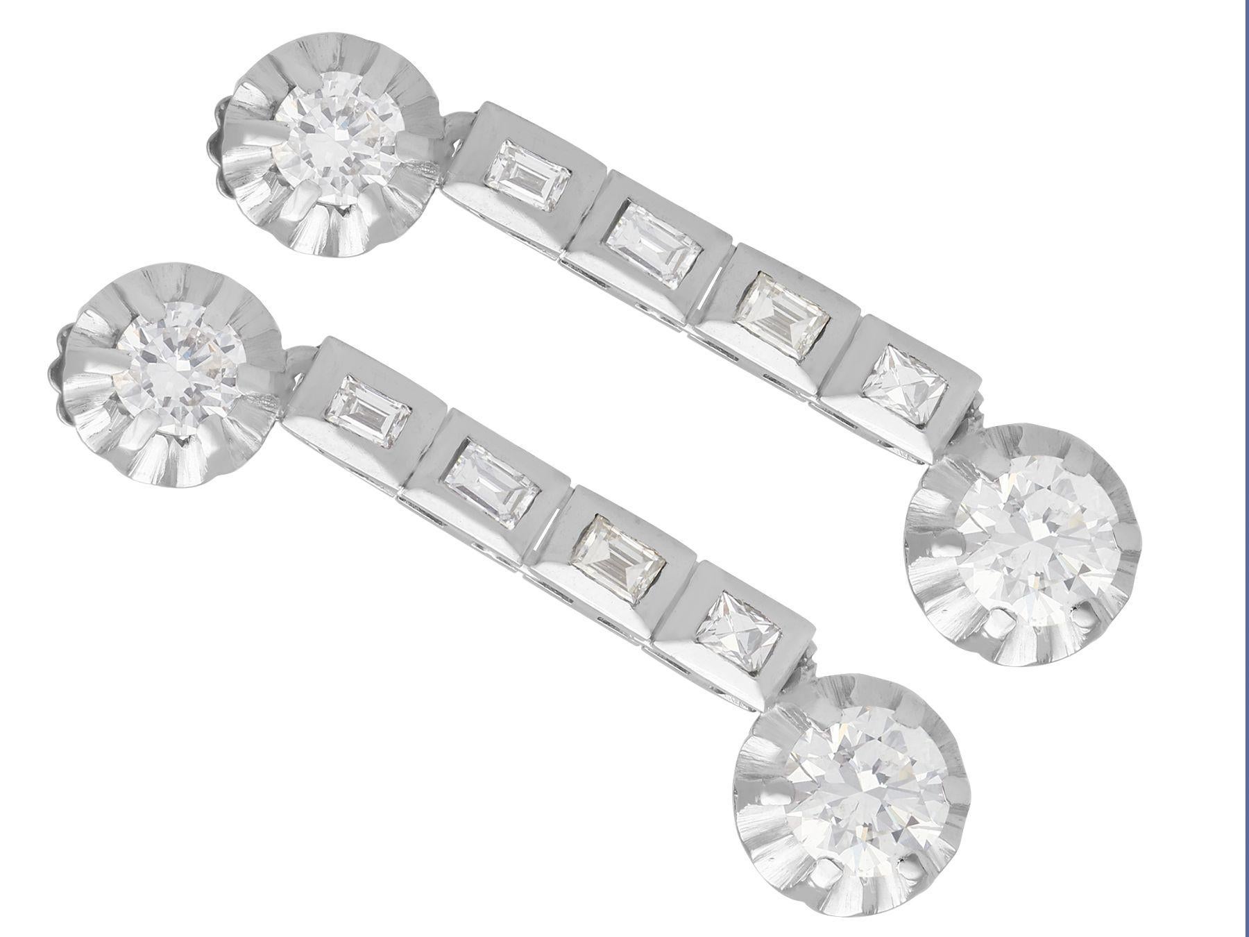 A stunning, fine and impressive pair of vintage 1950s 2.40 carat diamond and platinum drop earrings; part of our diverse diamond jewelry and estate jewelry collections.

These stunning, fine and impressive vintage drop earrings have been crafted in