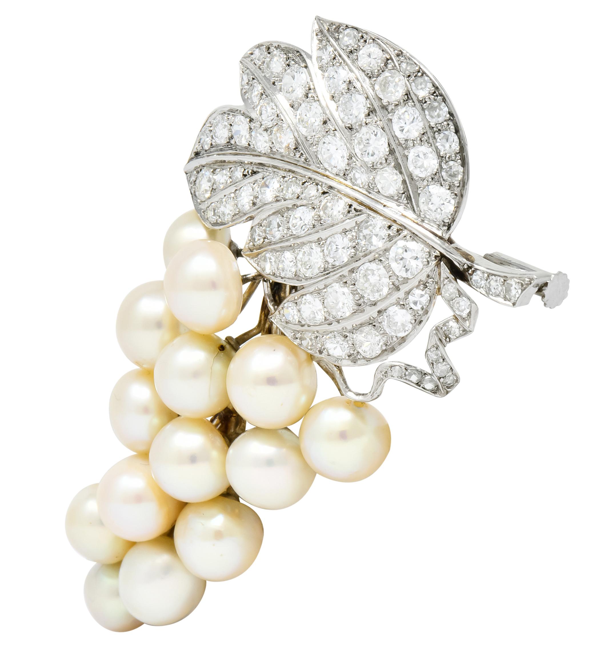 Designed as a leaf and cluster of fourteen “grapes” represented as round natural freshwater and saltwater button pearls measuring approximately 7.05 - 8.08 mm

Pearls are a mix of, very well matched, eleven saltwater pearls and three freshwater