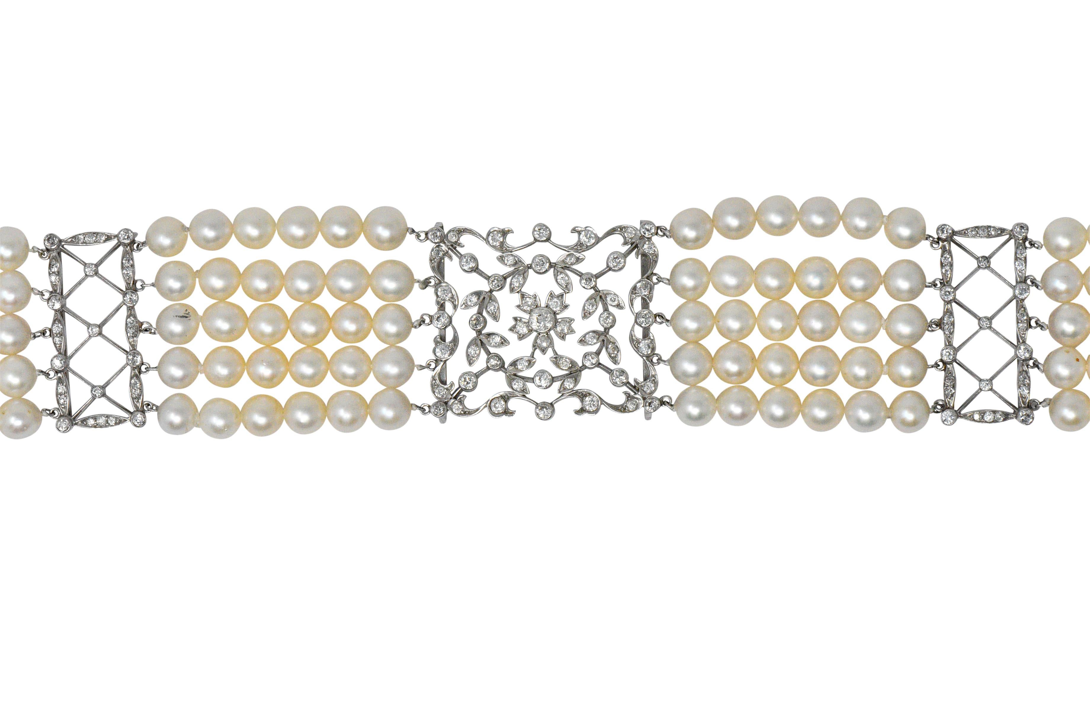 Featuring 5 strands of cultured pearls, 195 pearls total, measuring approximately 6.5 mm, off-round to round, white to cream body color, some with rose or green overtone, good to excellent luster and fair to excellent surface quality

Centering an