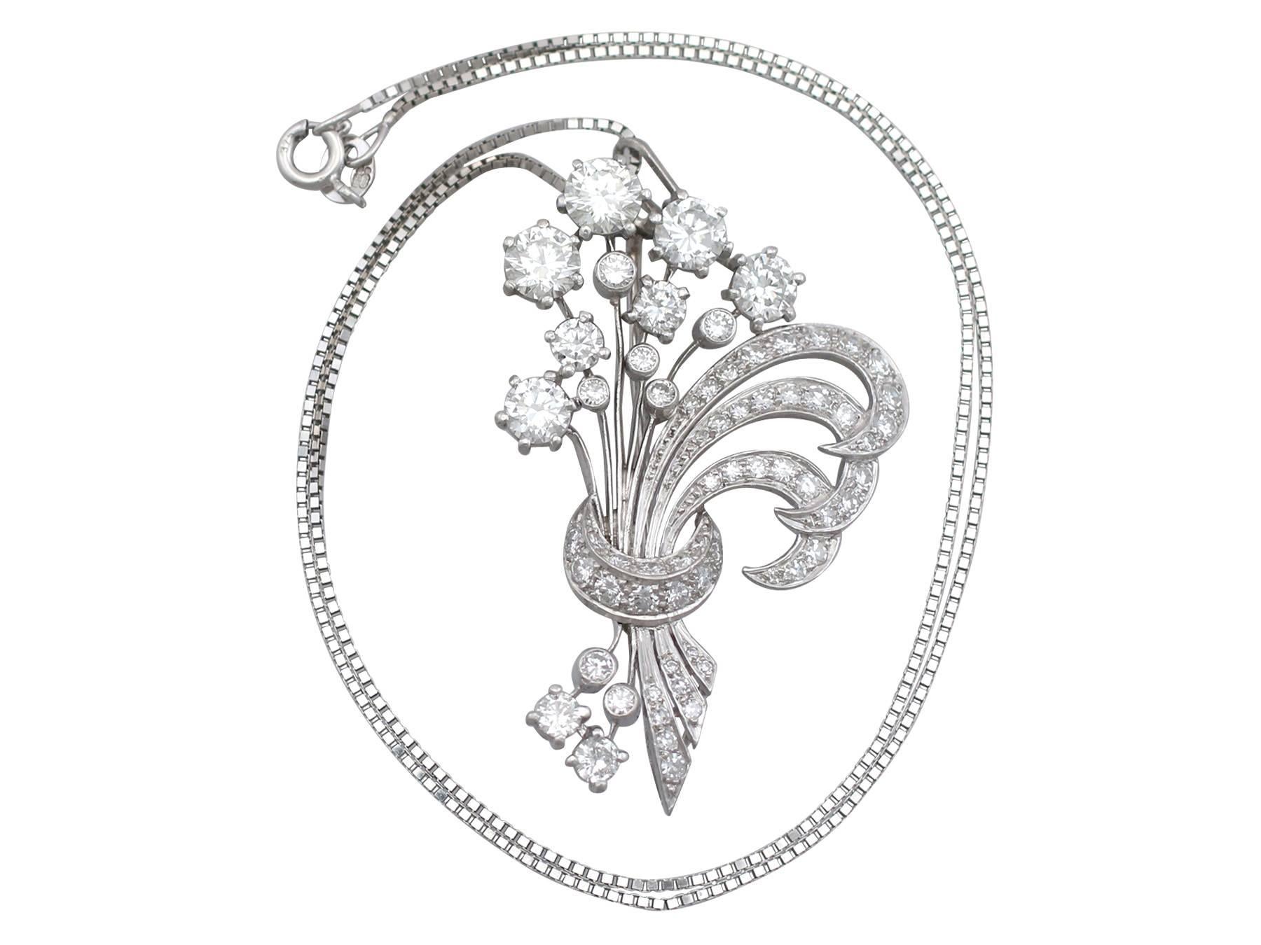 An exceptional, large and impressive vintage 4.98 carat diamond and platinum flower spray brooch / pendant; part of our diverse vintage jewelry and estate jewelry collections.

This exceptional and impressive vintage diamond brooch has been crafted