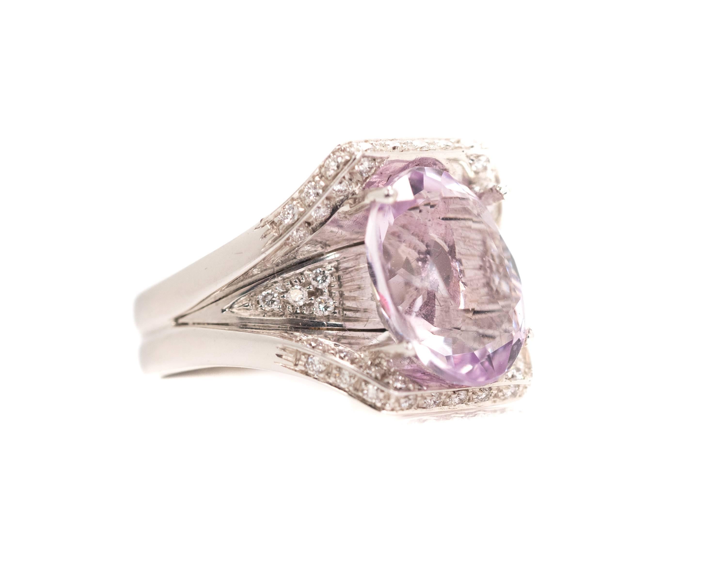 1950s Retro 5.5 Carat Kunzite Ring - 18K White Gold, Kunzite, Diamonds

Features a 5.5 carat Oval cut Kunzite center stone. The Kunzite is a very transparent, light purple color. It is securely prong set in a shining 
18K White Gold Cathedral