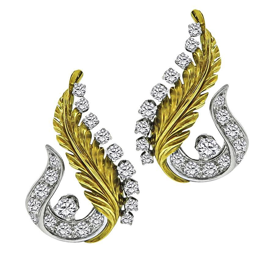 This is an amazing 18k yellow gold and platinum double clip and earrings set. The set features sparkling round and baguette cut diamonds that weigh approximately 6.00ct. The color of these diamonds is F-G with VS clarity. The pin measures 36.5mm by