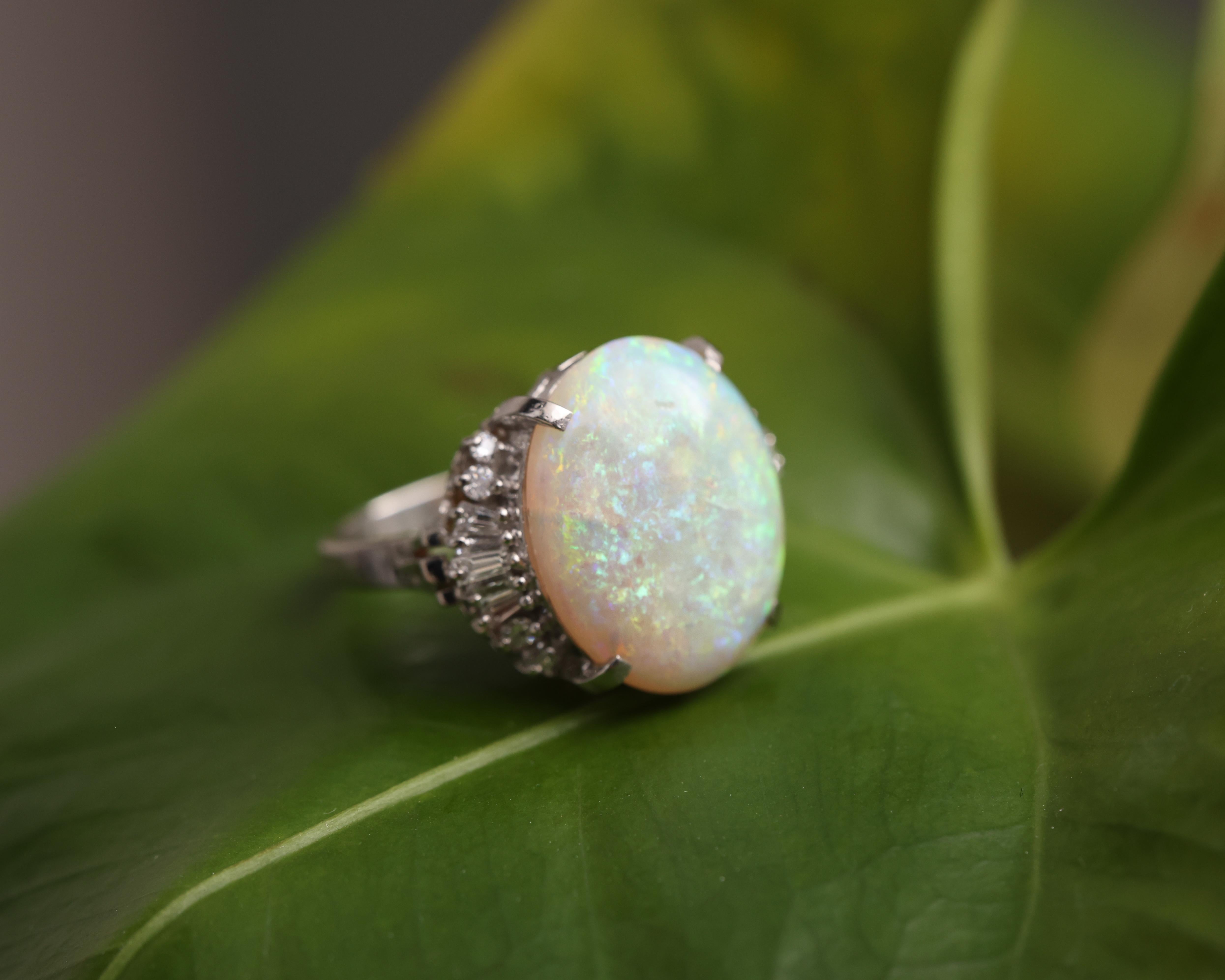 Oval Cut 1950s 7.99 Carat Opal and 0.48 Carat Diamond Platinum Cocktail Ring For Sale