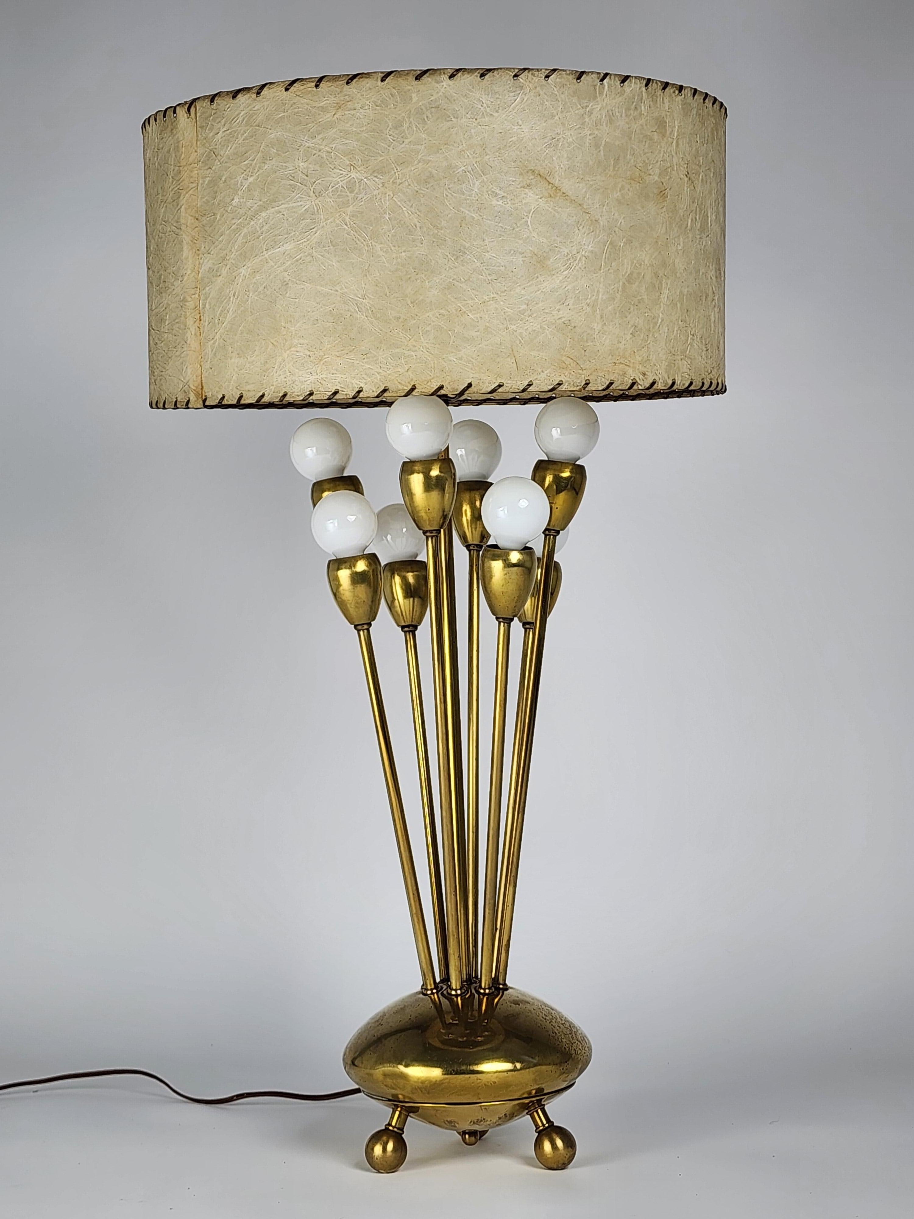 Bold 1950s Sputnik brass table lamp with 9 arm from Majestic Lamp Corp. USA 

Well made. Solid sturdy construction. 

Rotating on/off switch on base control different light configuration on 8 arm. 

8 E12 candelabra Size socket rated at 25 watt.