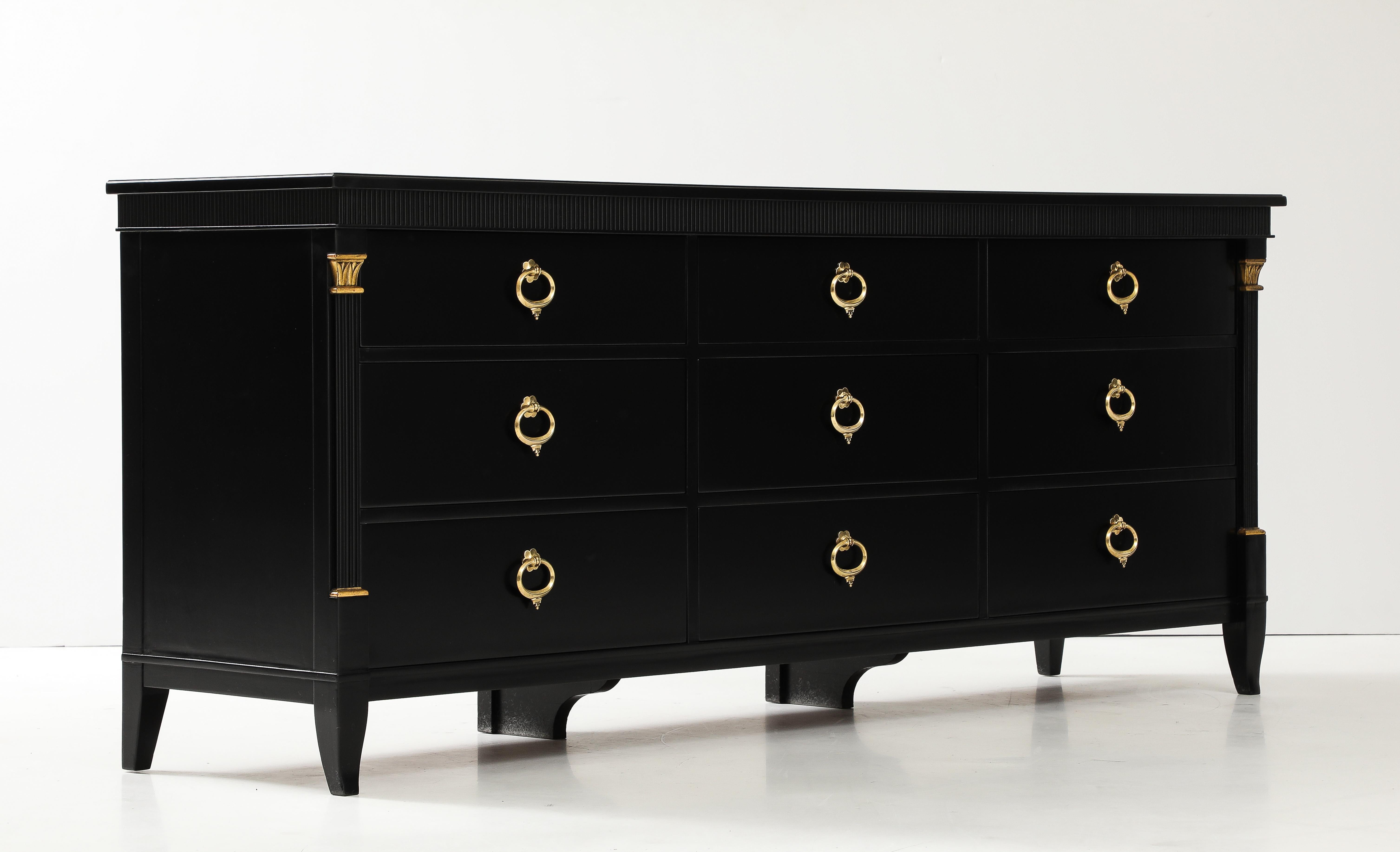 Amazing 1950's 9 drawer dresser by Baker furniture with solid brass Italian hardware, fully restored and lacquer in black with minor wear and patina due to age and use.