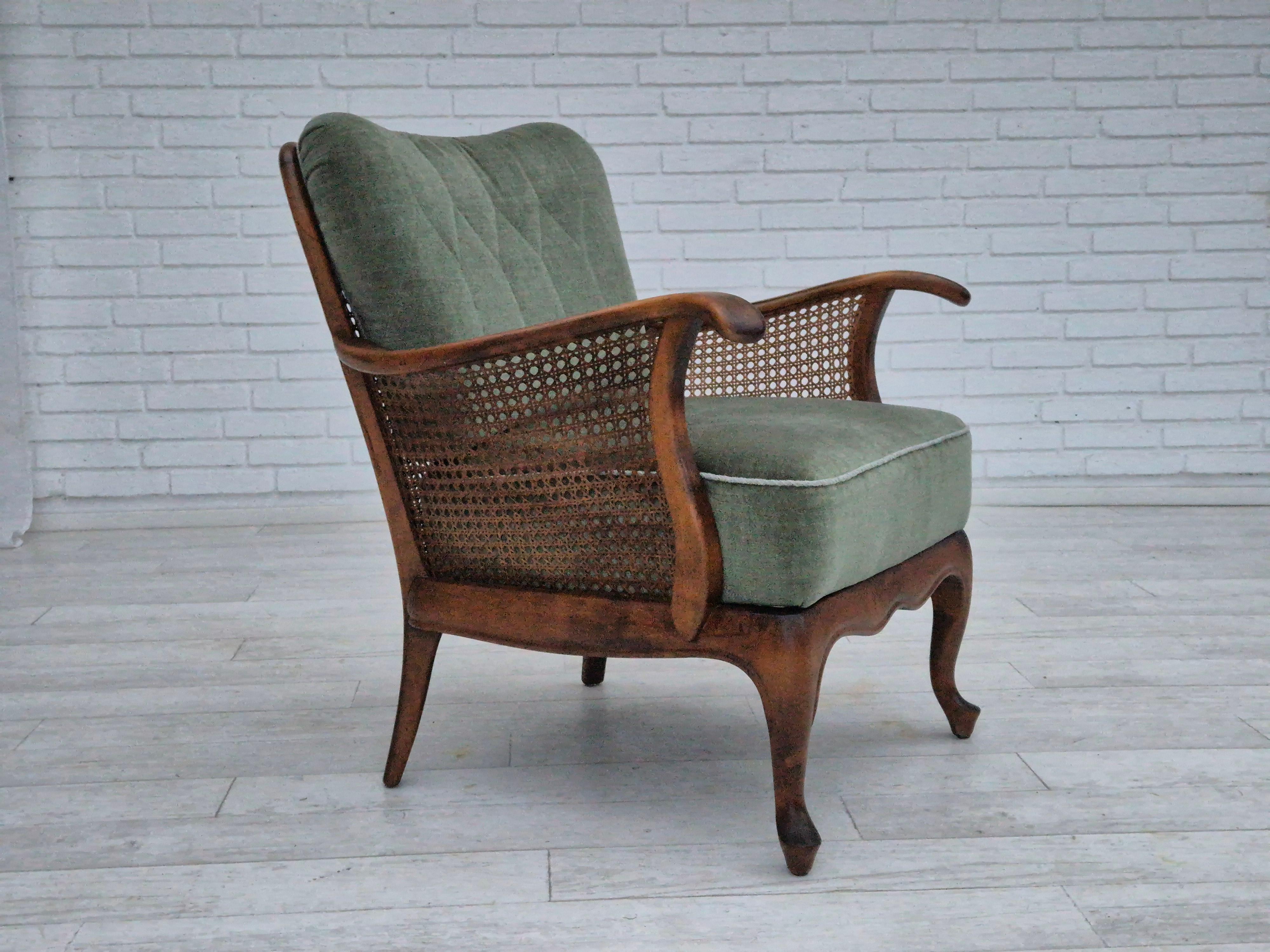 1950s, a pair of Danish armchairs in original very good condition: no smells and no stains. Light green furniture velour, ash wood, furniture mesh. Springs in the seat cushions. Manufactured by Danish furniture manufacturer in about 1950-55s