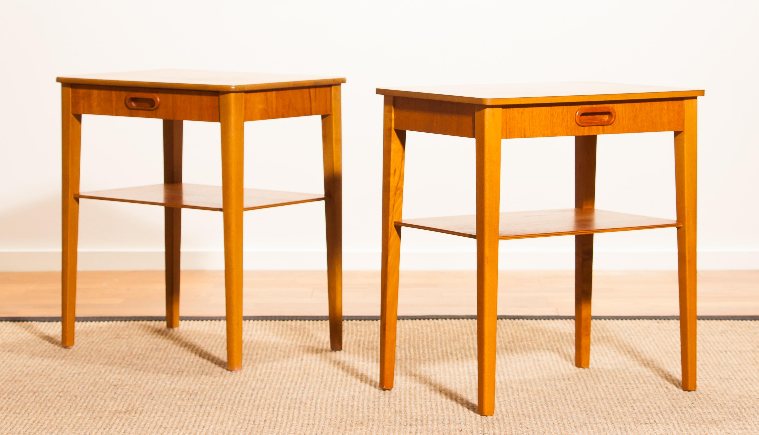 Beautiful pair of bedside tables by Björkås Möbelfabrik, Sweden.
They are made of teak, with single drawer and magazine shelf.
The tables are in a very nice condition.
Period 1950s.
Dimensions H 50 cm, W 45 cm, D 32 cm.