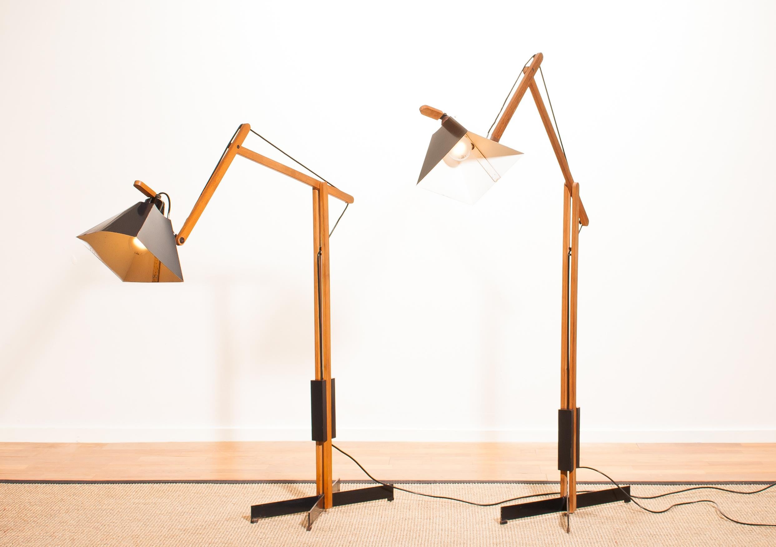 Magnificent rare floor lamps by Luxus, Sweden.
These lamps are adjustable by a counterbalance.
The stands are made of teak with a black lacquered shade.
They are labelled by Luxus and are in a beautiful condition.
Period 1950s.
Dimensions: H