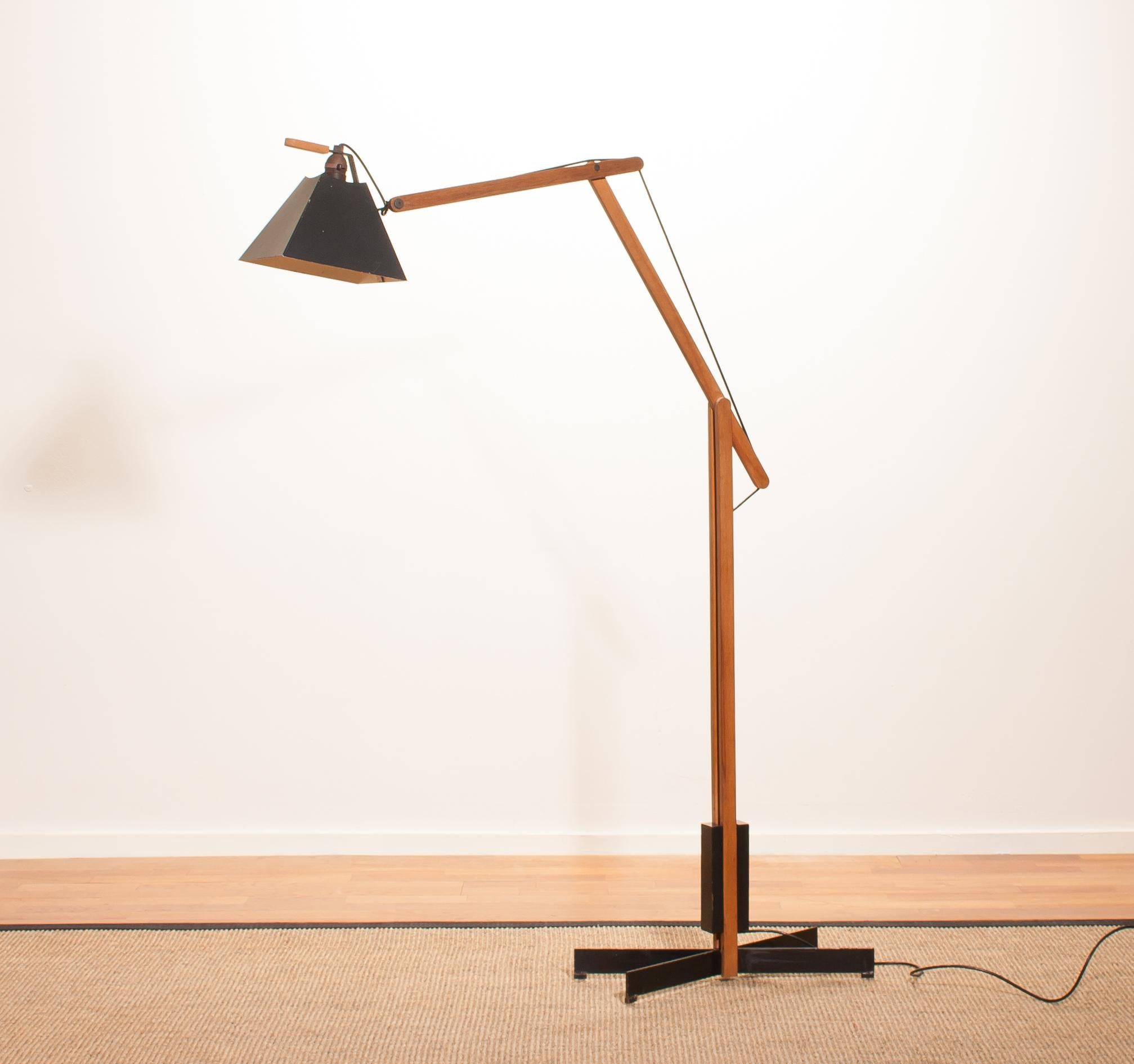 Magnificent rare floor lamps by Luxus, Sweden.
These lamps are adjustable by a counterbalance.
The stands are made of teak with a black lacquered shade.
They are labeled by Luxus and are in a beautiful condition.
Period 1950s.
Dimensions: H 125