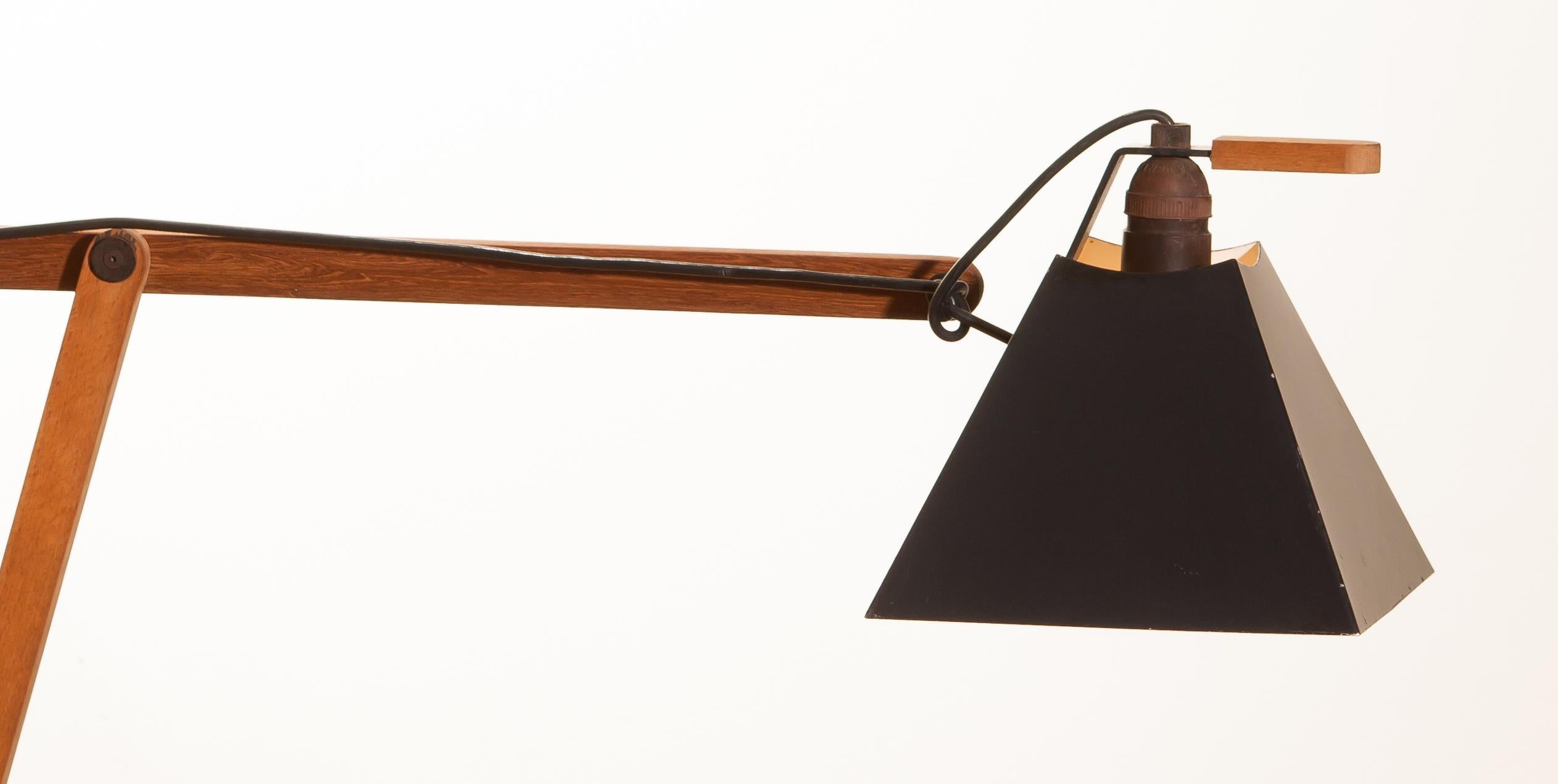 Magnificent rare floor lamps by Luxus, Sweden.
These lamps are adjustable by a counterbalance.
The stands are made of teak with a black lacquered shade.
They are labelled by Luxus and are in a beautiful condition.
Period 1950s.
Dimensions: H
