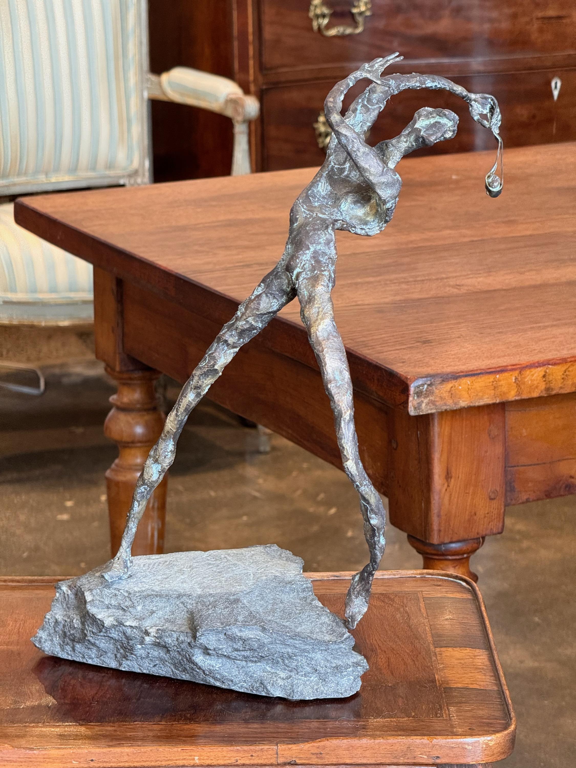 An interesting bronze sculpture. Mounted on stone.