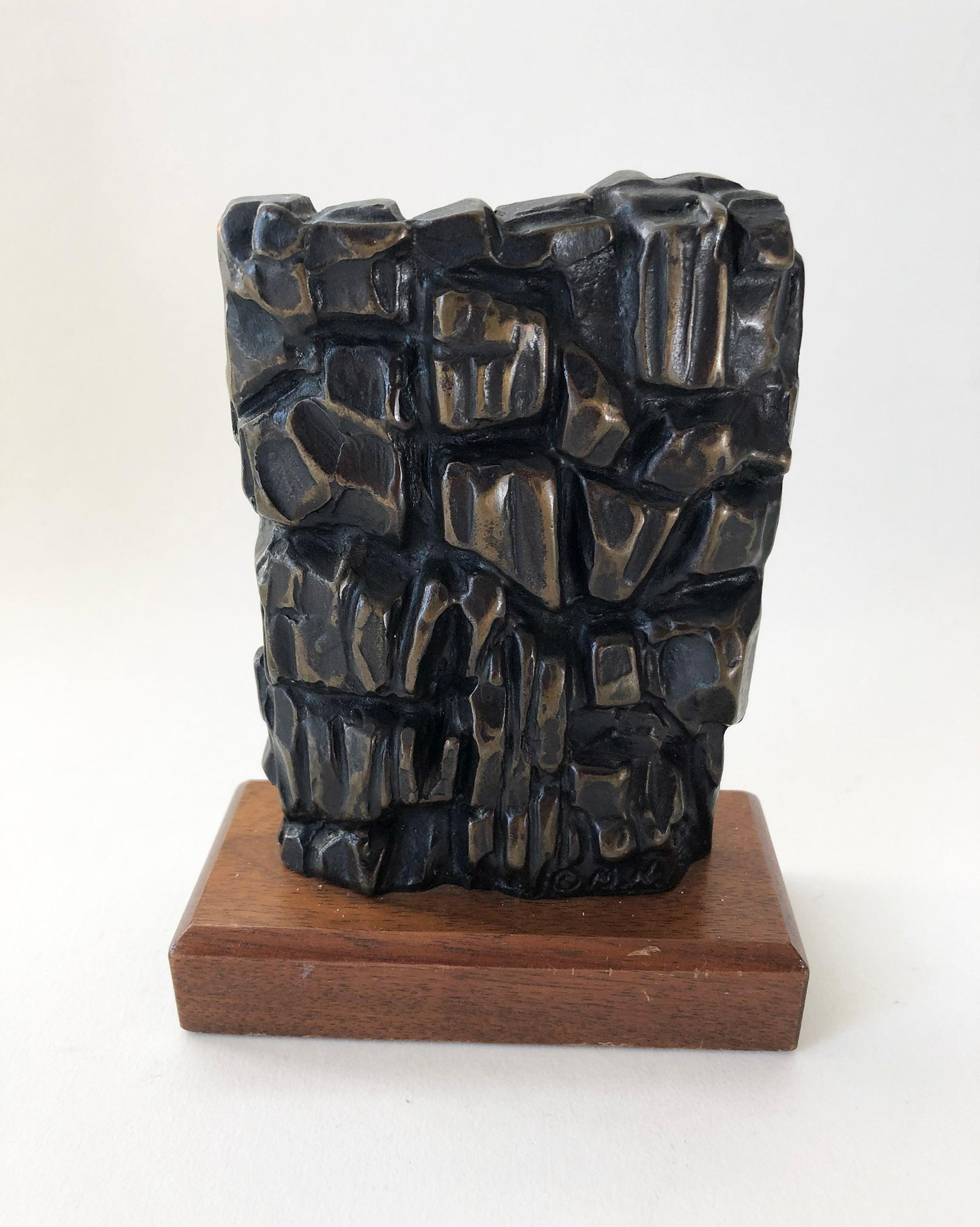 Abstract modernist heavy bronze signed sculpture on wood base signed MM, artist unknown. Sculpture measures 5