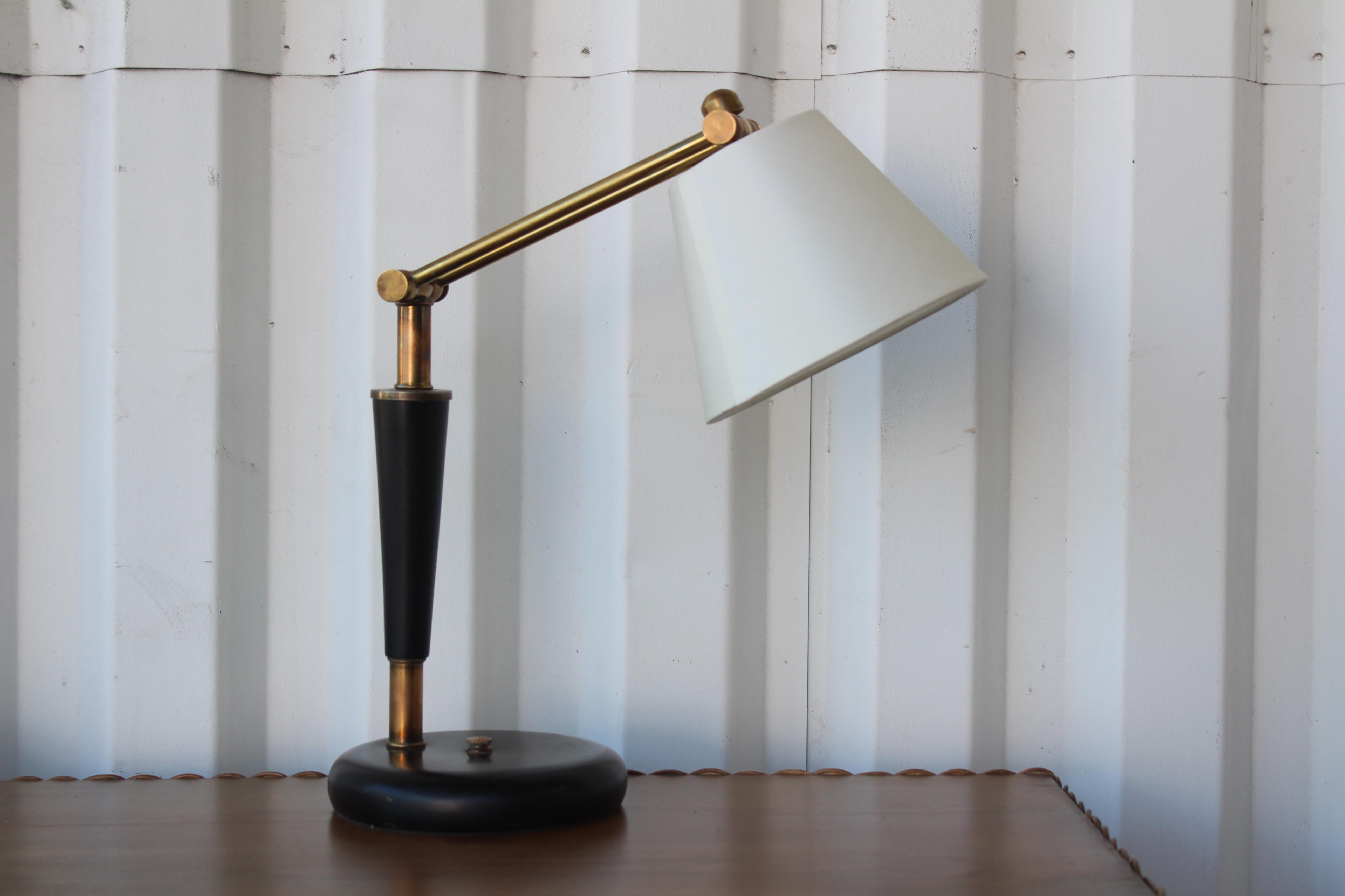 Vintage 1950s French desk lamp. Metal base, wood stem in a black finish and brass adjustable arm. Newly rewired and fitted with a new custom silk shade.