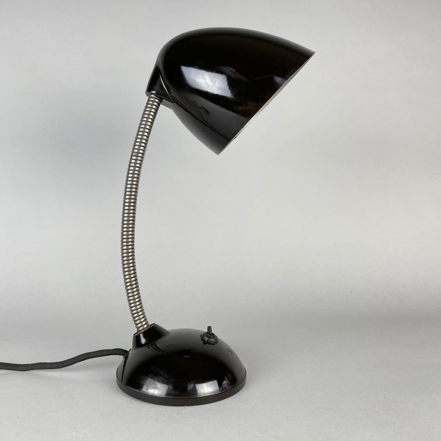 Iconic table lamp by Eric Kirkman Cole was produced in Czecholovakia. Very good original condition. Fully functional.