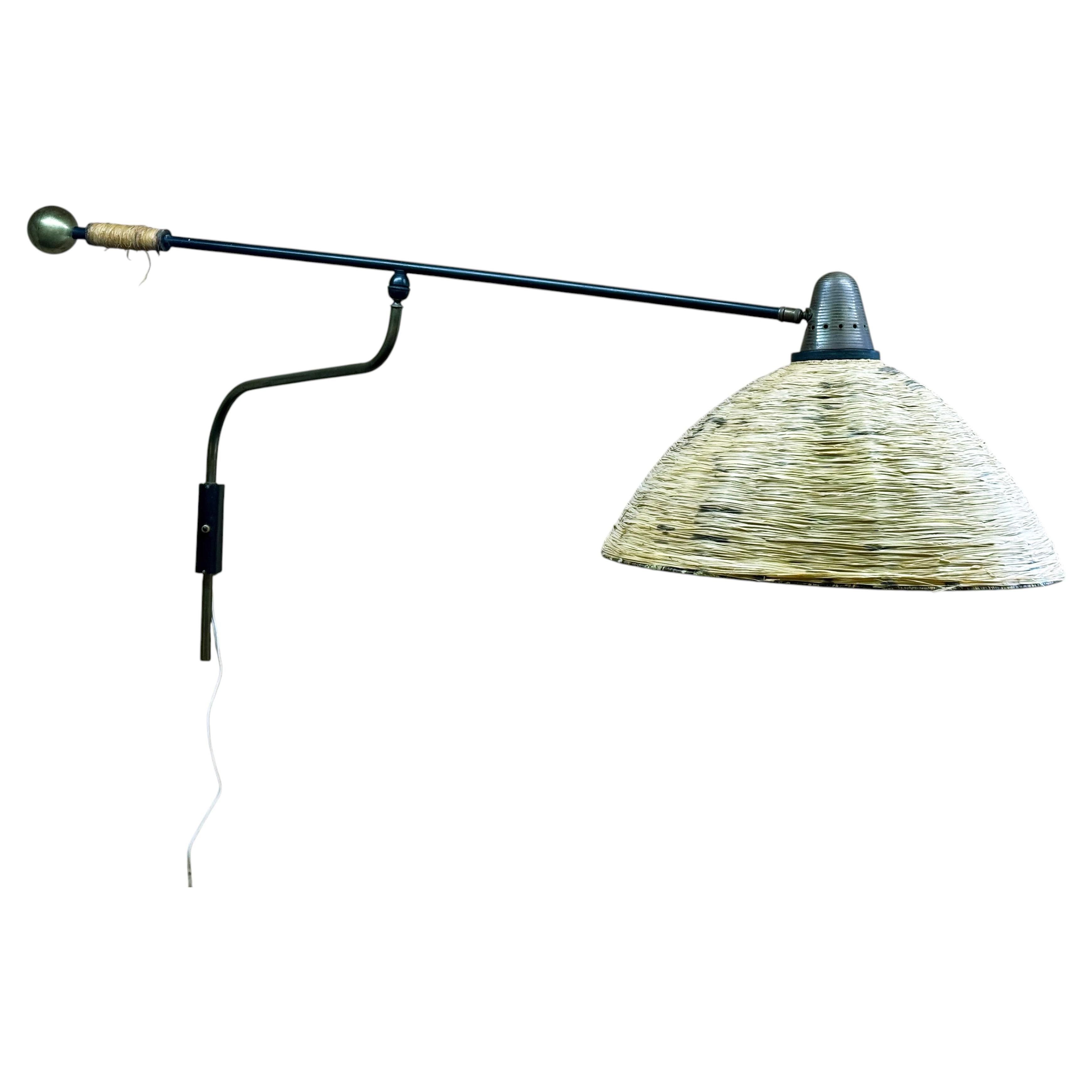 1950s Adjustable Wall Lamp by Maison Arlus in brass, metal, and rattan For Sale