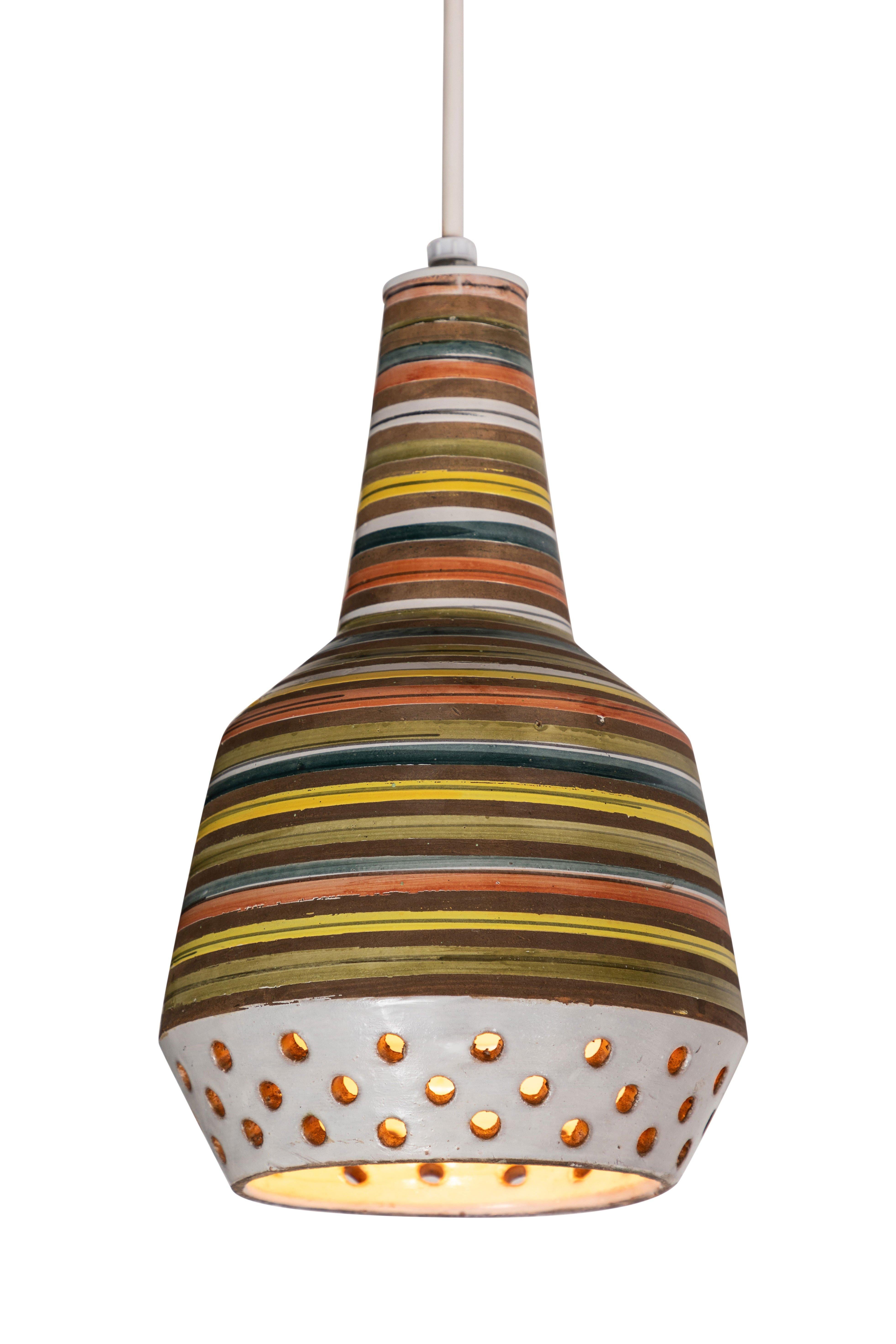 1950s Aldo Londi ceramic Bitossi pendant lamp for Italian Raymor. This rare and sculptural Italian ceramic lamp is executed with multicolored glazed horizontal stripes and geometric circular perforations.

Two lamps available. Price is per item.