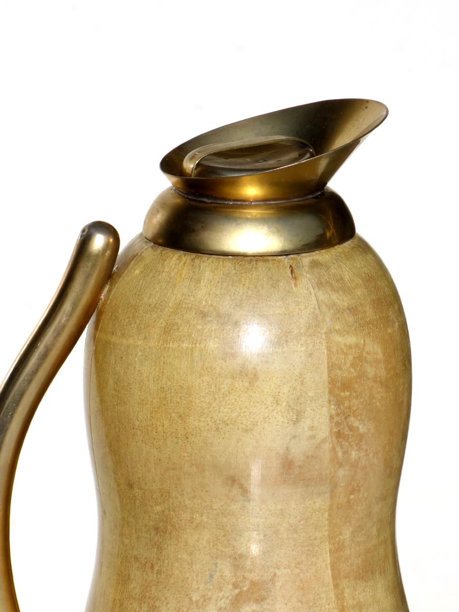 Aldo Tura
Thermal carafe
Italy, 1950

Wood covered with parchment
Metal Details

Excellent condition