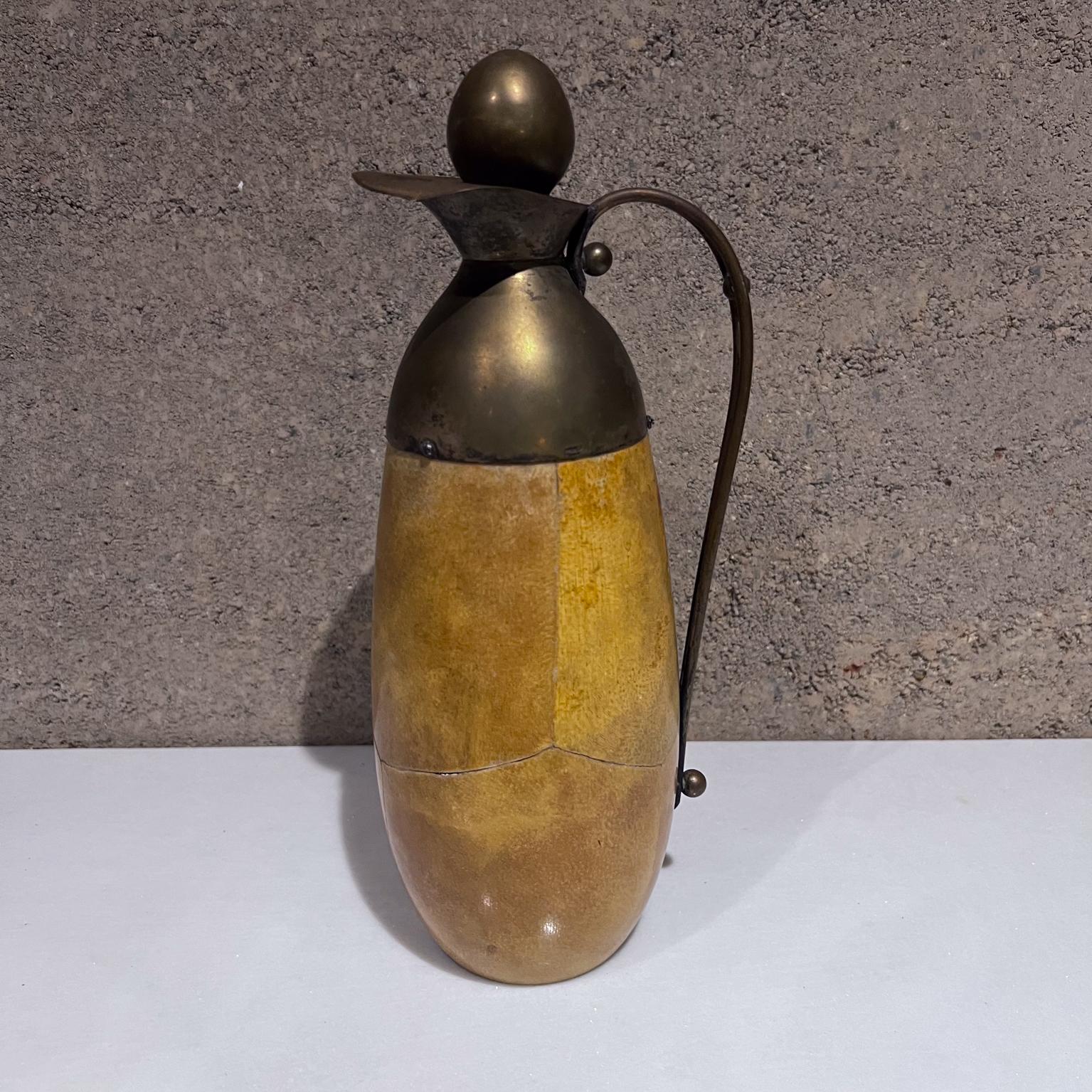 AMBIANIC presents
1950s Aldo Tura Goatskin and Brass Carafe Thermos Pitcher Barware
made in Italy, maker stamped.
11.5 h x 3.75 diameter x 4.5 d
Preowned vintage wear, see all images provided.