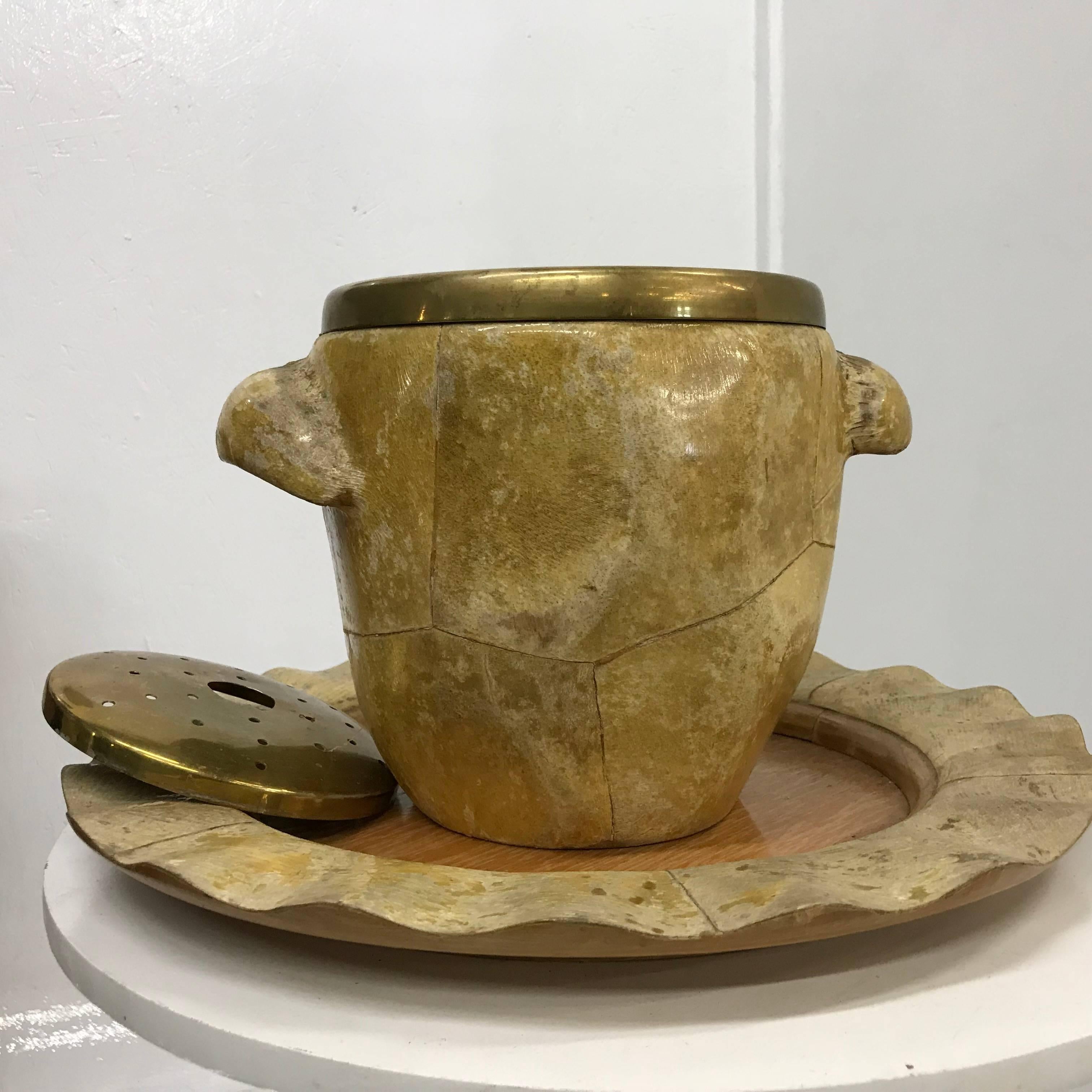 A beautiful goatskin, wood and brass serving set by Aldo Tura Macabo Cusano.
Comprising of an ice bucket/champagne holder and a beautiful scalloped wooden tray,
circa 1950s. 
Beautiful original distressed condition.
Measures:
Ice Bucket 11