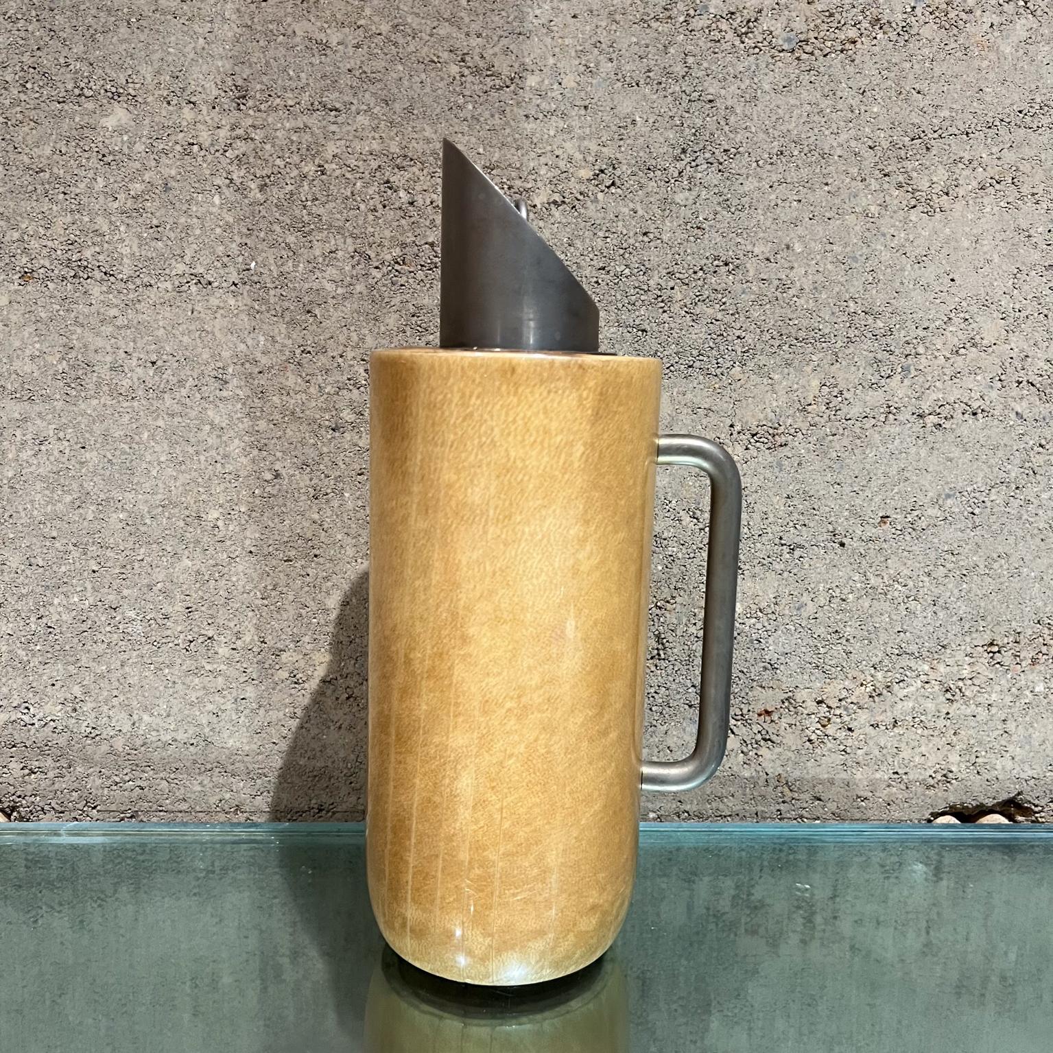 AMBIANIC presents 
1950s Aldo Tura Modern Pitcher Carafe Thermos Goatskin Italy
Goatskin and metal
Missing original label.
12 h x 6 d x 4 diameter
Preowned original unrestored vintage condition. 
Wear and stains on the top.
Refer to all images for