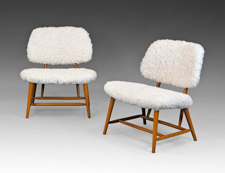 Pair of swedish modern lounge chairs in beech and sheepskin by Alf Svensson for x, 1950´s. New shearling upholstery and restaured.