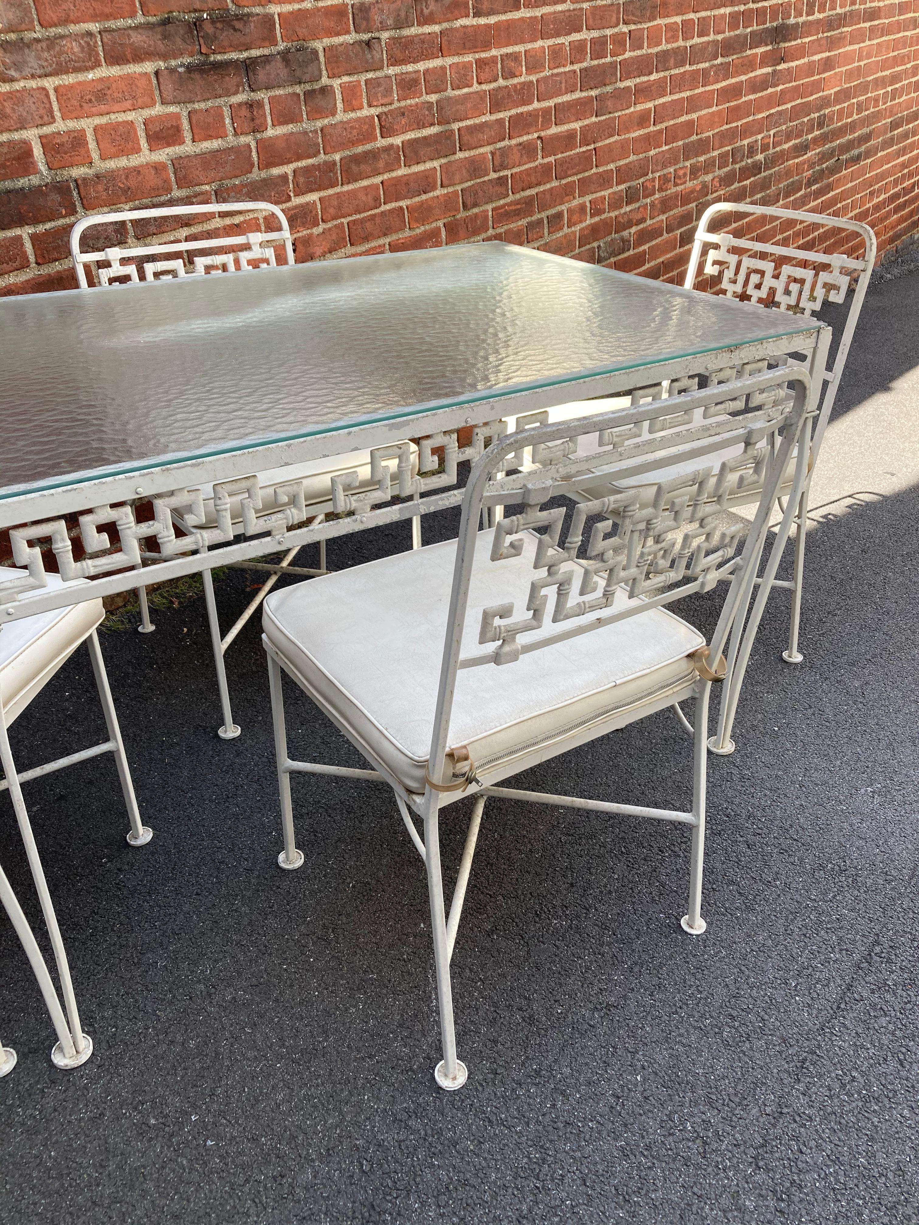 1950s aluminum Greek key patio set by Molla. 4 chairs and 1 table.