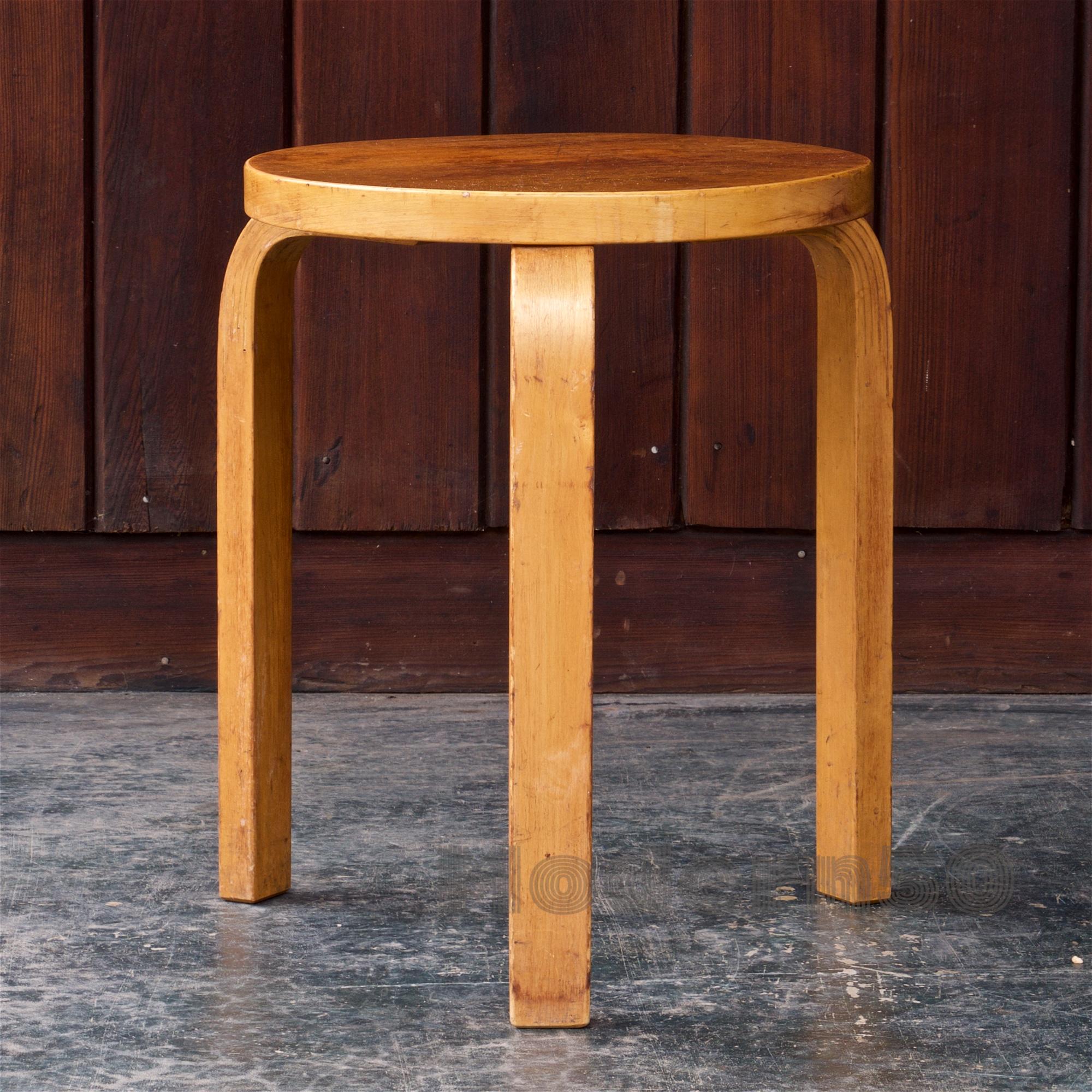 Wonderful and well used 1950s version of the model 60 Trileg stool. Strong and still good for gentle uses. Rare with teak surface. Legs bend out about 1 1/2 inches beyond stated top diameter.