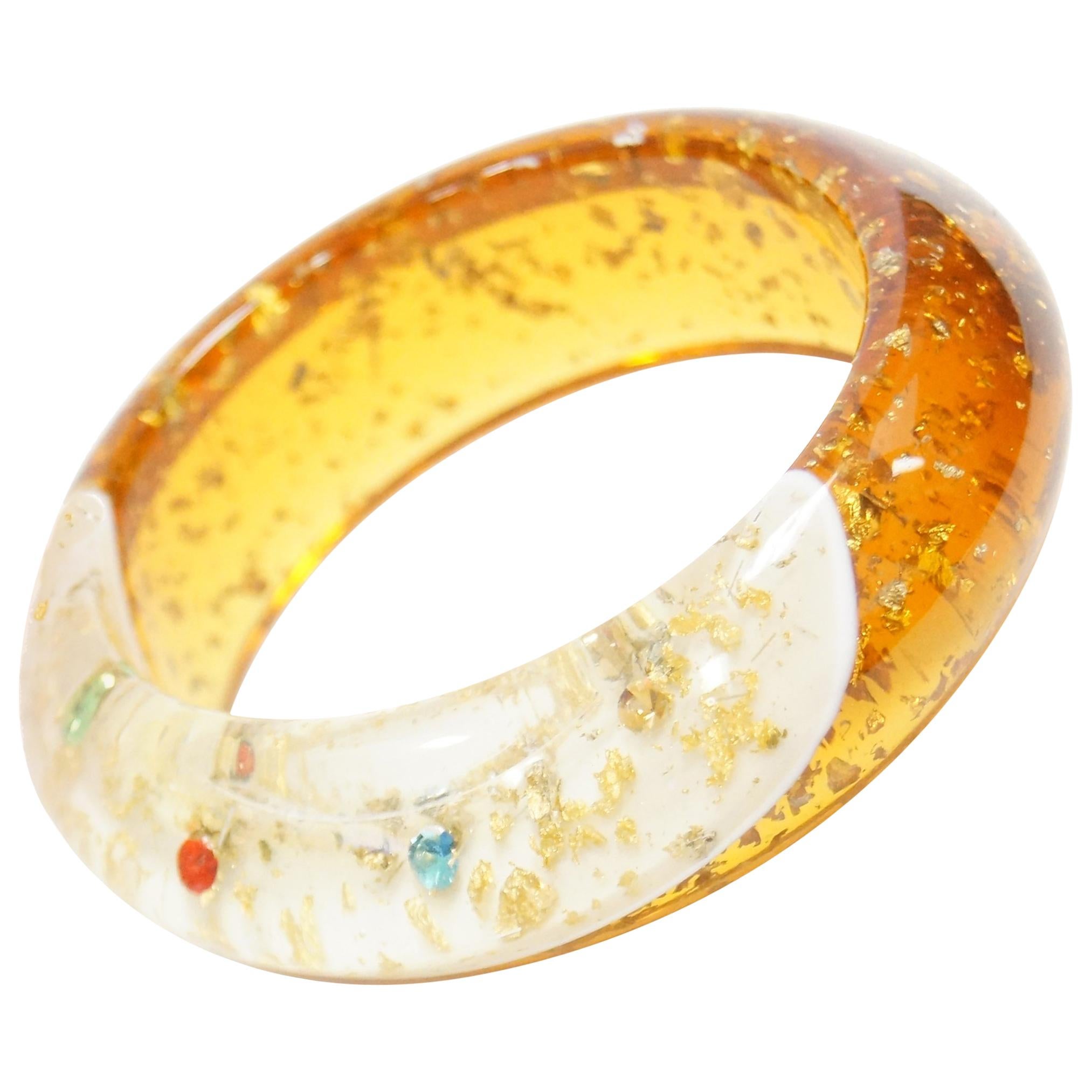 1950s Amber Lucite Bangle with Glitter and Rhinestone Inclusions For Sale