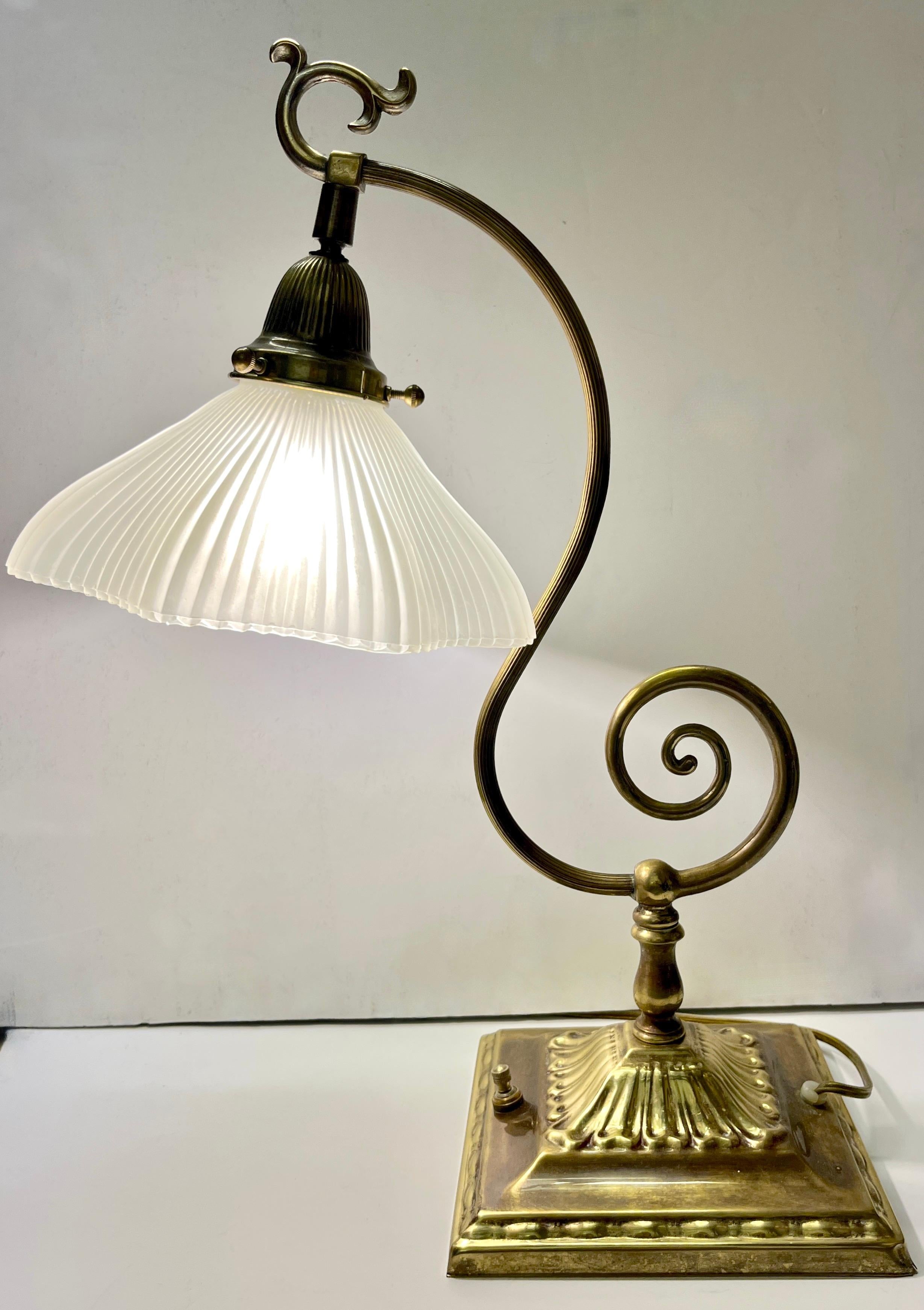 A vintage brass table or desk lamp with an enticing design, the stepped square base (6.75