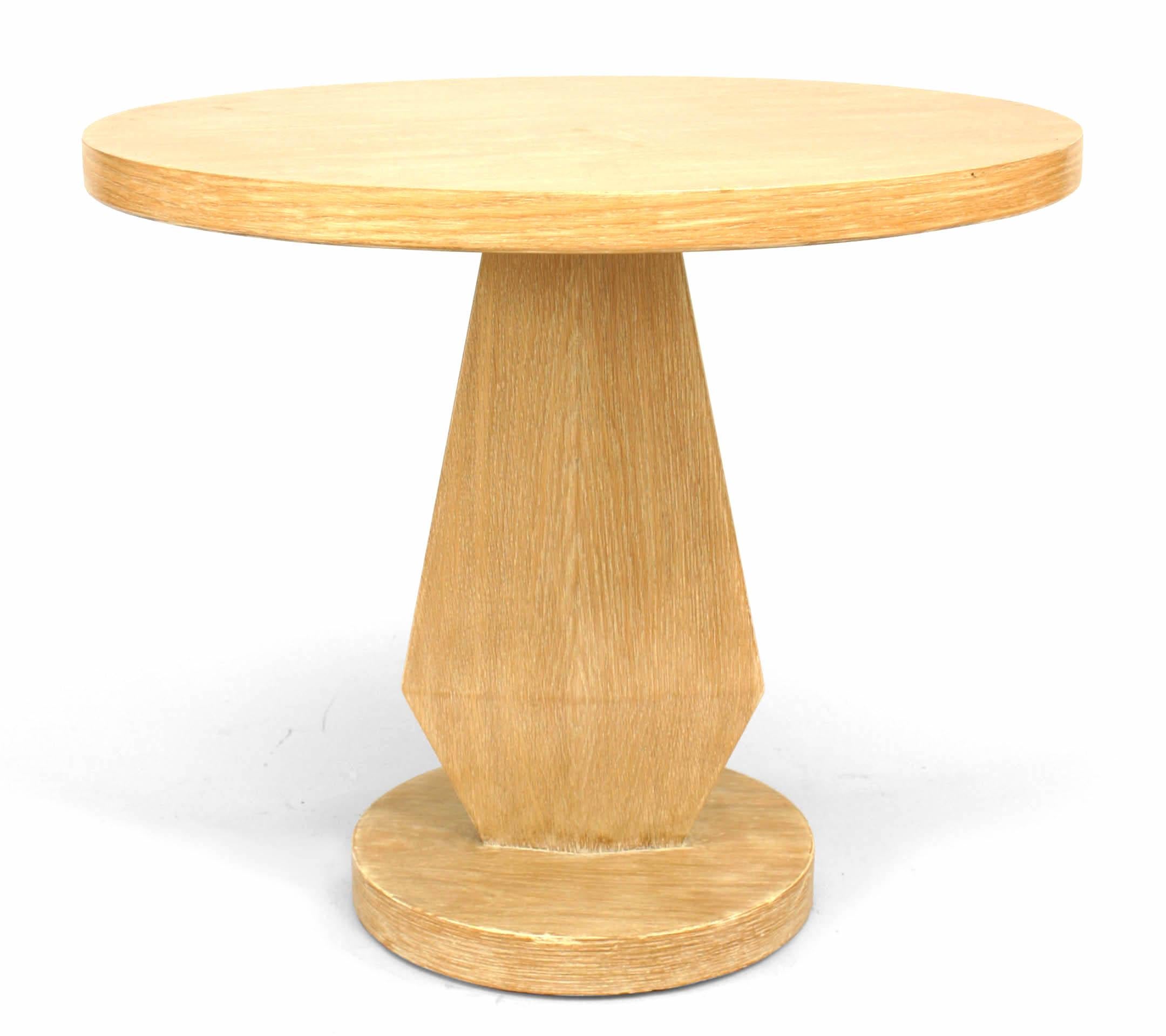 American Mid-Century (1950s) limewood round end table supported on a geometric shaped pedestal base
