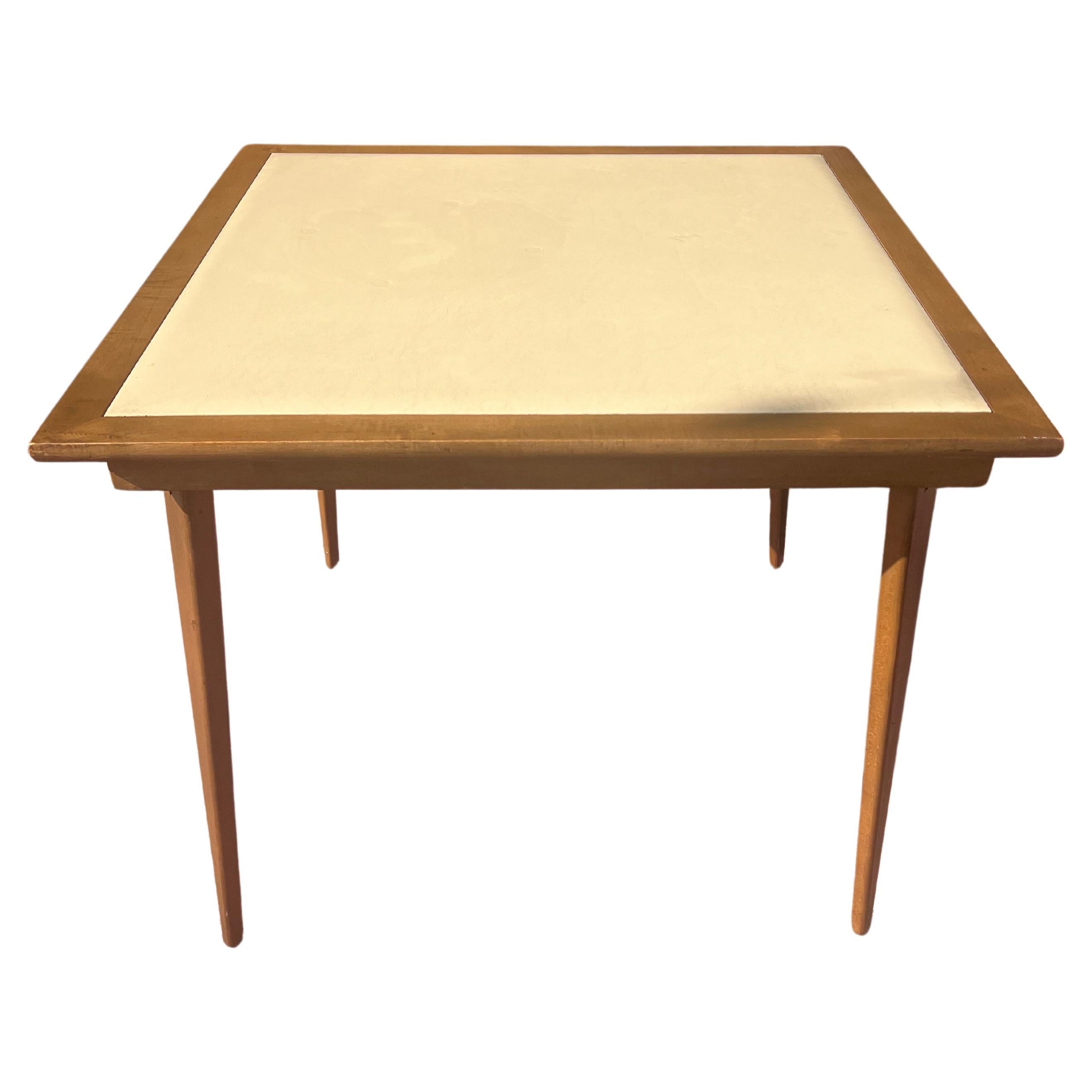 versatile and practical American mid-century modern Folding table with cream color naugahyde top and walnut frame, very nice condition and light use standard high for dining or for playing, light and sturdy circa 1950's.nice tapered legs easy to