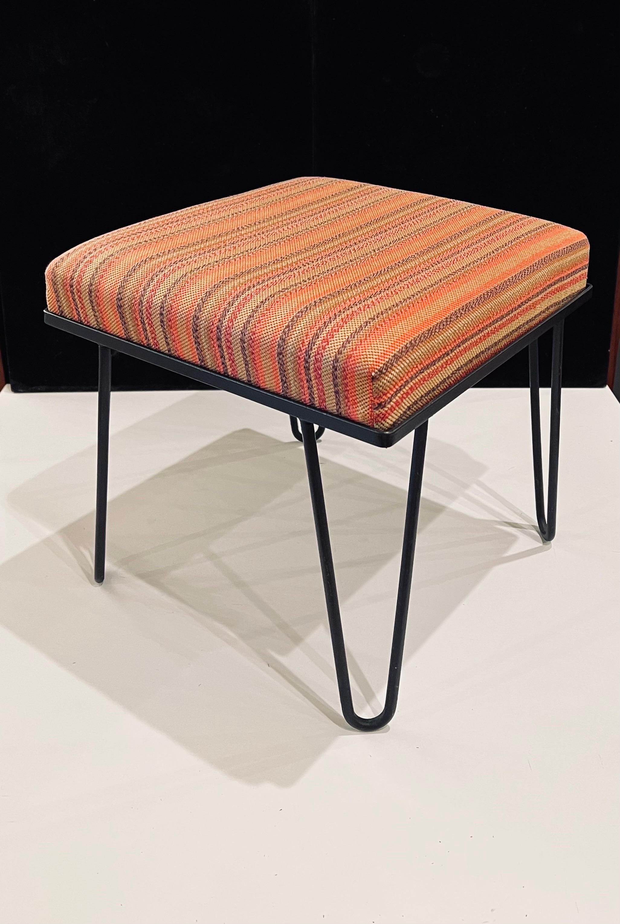 Versatile Upholstered Seat with solid iron hairpin legs and petite stool. circa 1950's with original fabric by Alexander Girard, simple design all original condition light faded fabric but no tears.