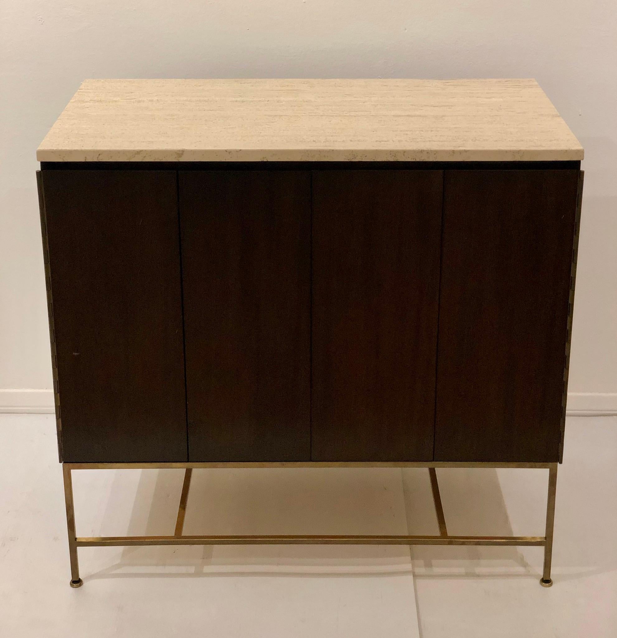 American Mid-Century Modern, Elegant cabinet dresser designed by Paul McCobb, with folding doors and 4 drawers, refinished in chocolate finish, with Travertine top and brass base, this beauty its hard to find part of the Calvin group, circa 1950s.