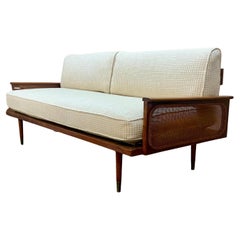 1950s American Walnut Sofa with Rattan Panels