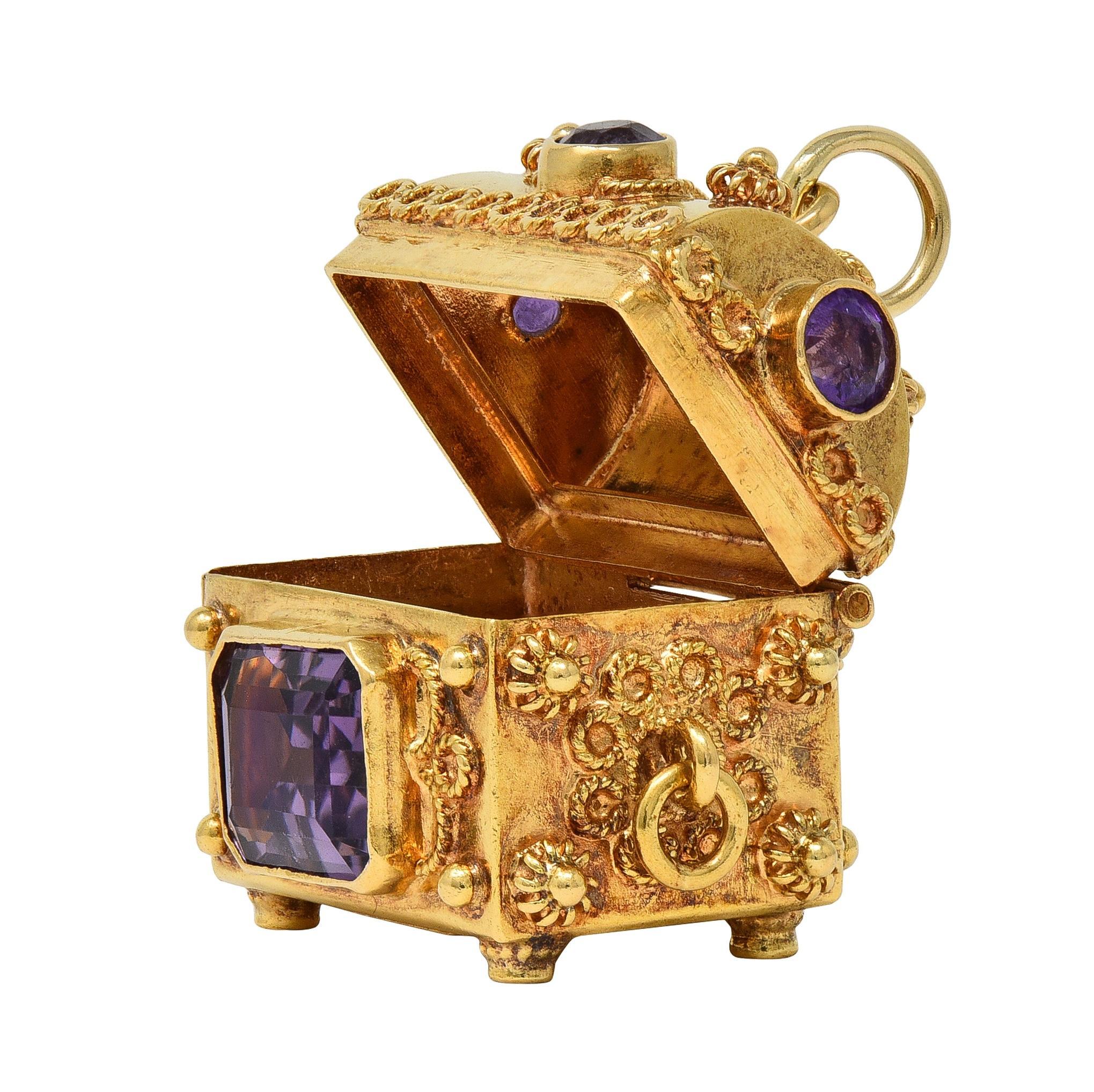 Designed as an ornate and dimensional chest with a functional hinged top
Featuring twisted filigree appliqué with granulated detailing and four feet
Accented by round and emerald cut amethyst bezel set on sides and top
Weighing approximately 8.18