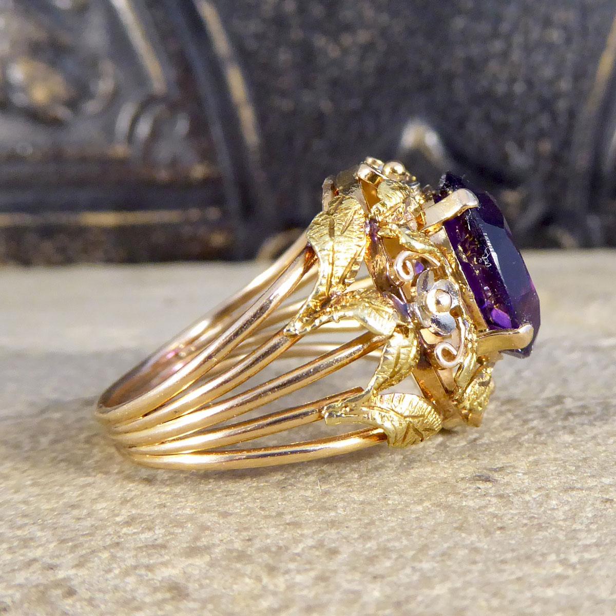 Such a gorgeous vintage ring that has been crafted in the 1950's. It features a beautiful big and vibrant Amethyst gemstone in the centre with a claw setting. The ring itself has a filigree pattern to the head and down the shoulders crafted in 14ct