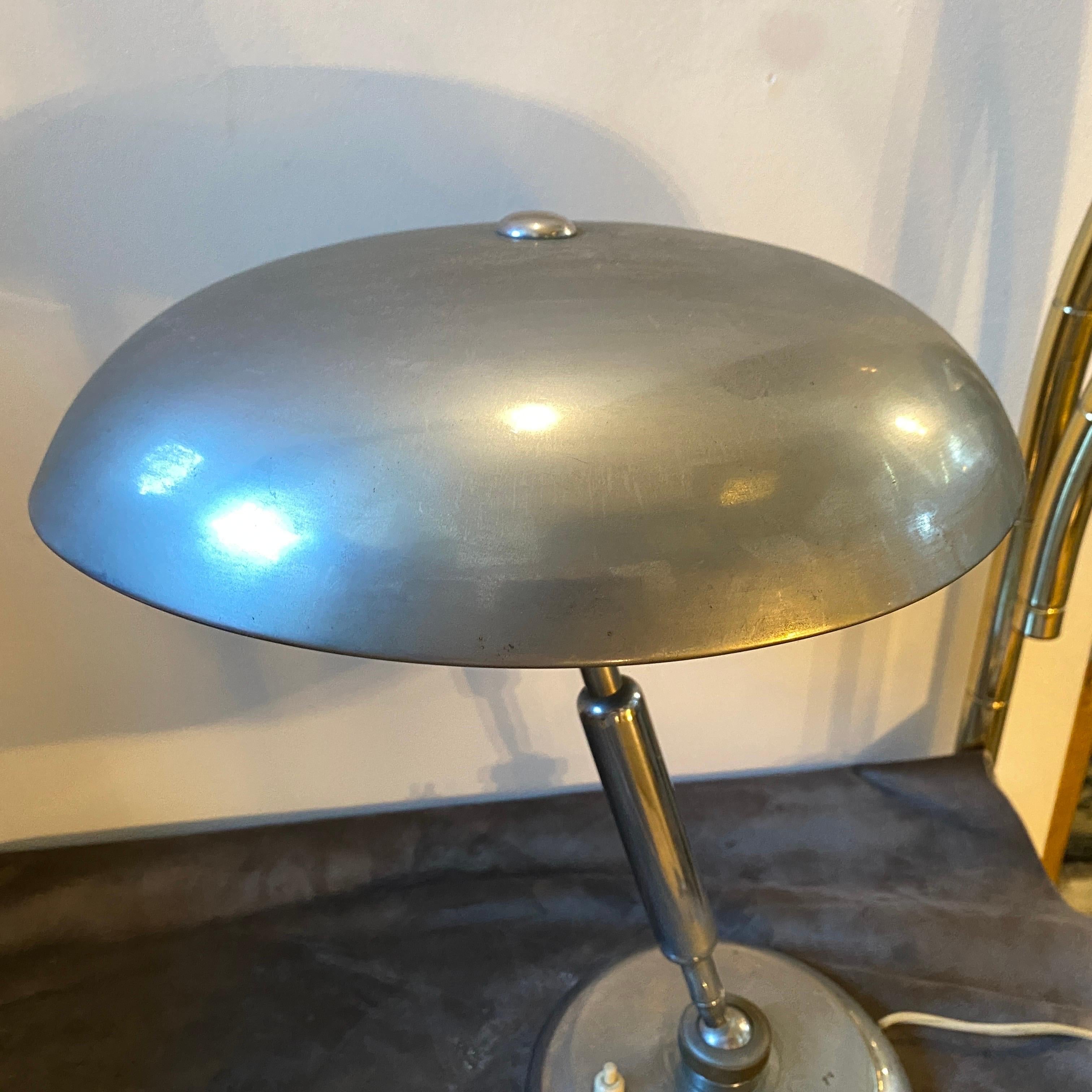 A Mid-Century Modern italian desk lamp inspired by Angelo Lelii. It's has been checked by an electrician, it works both 110-240 volts and needs two regular e27 bulbs.