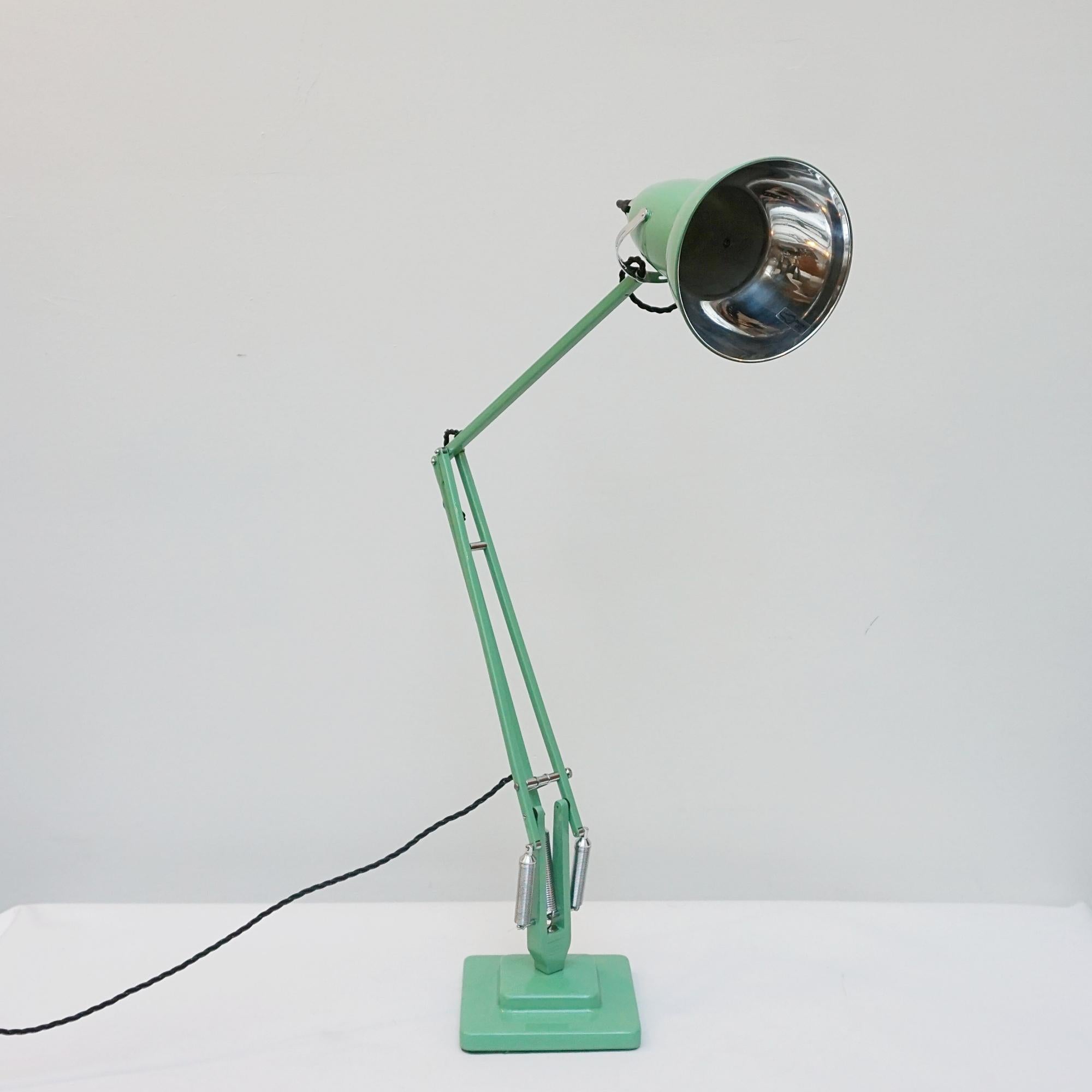 'Three-spring' chromed and polished green painted Anglepoise desk lamp by Herbert Terry & Sons. Two step base and perforated lamp shade. Original stamps to stem. The three spring Anglepoise lamp was first released by Herbert Terry &Sons in 1935. 