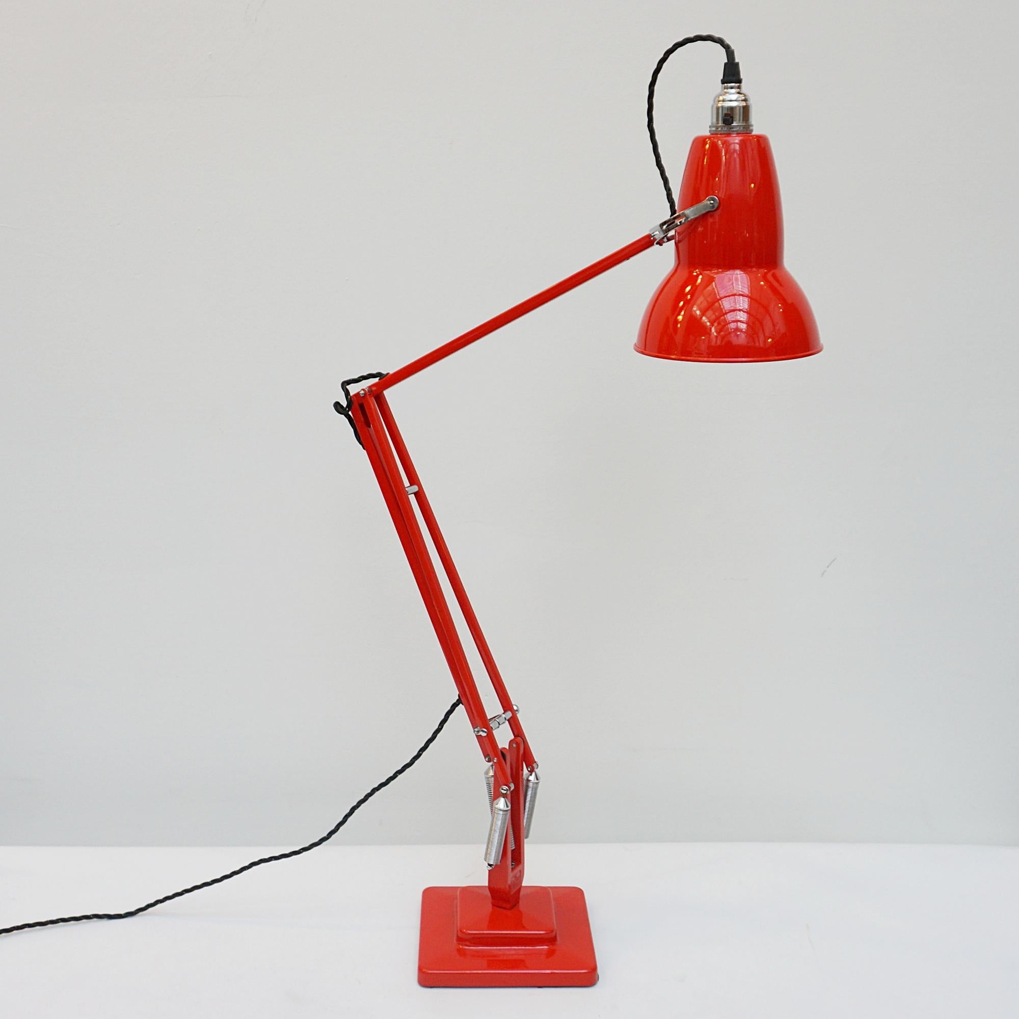 'Three-spring' chromed and polished red painted Anglepoise desk lamp by Herbert Terry & Sons. Two step base and perforated lamp shade. Original stamps to stem. The three spring Anglepoise lamp was first released by Herbert Terry &Sons in 1935. 