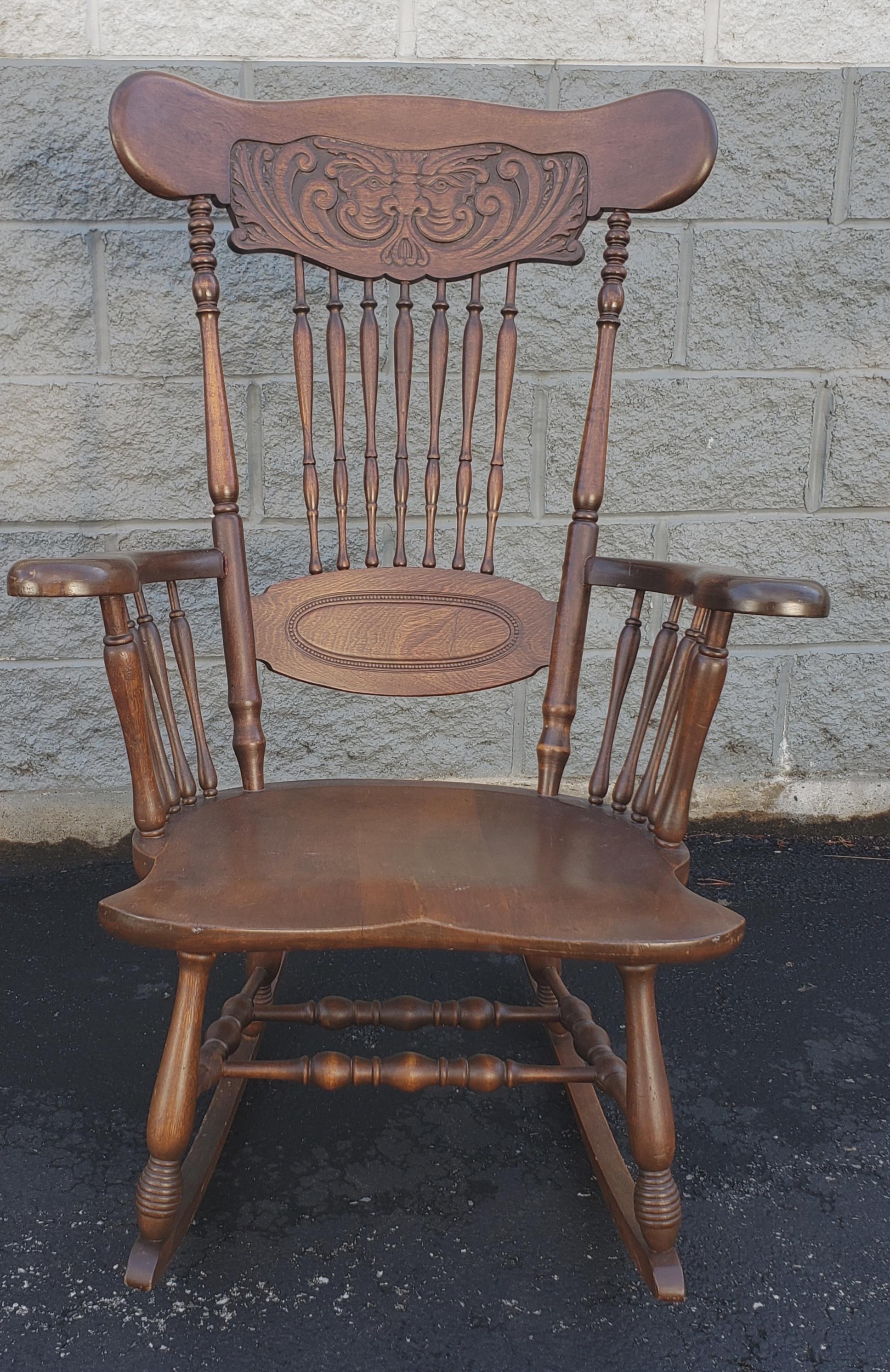 1950s Anglo Inglo-Indian carved walnut rocking chairs with hand carved indian figure on back.
Measures 27