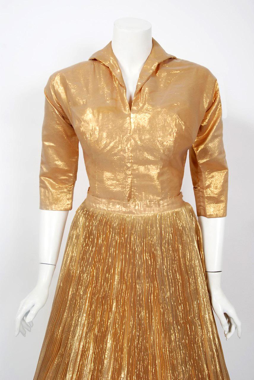 A gorgeous 1950's Anita Bari of New York designer ensemble that will light up any room! This alluring matching set is made of an opulent metallic gold-lamé with a beautifully pleated skirt construction. This really gives the lamé depth and a bit of