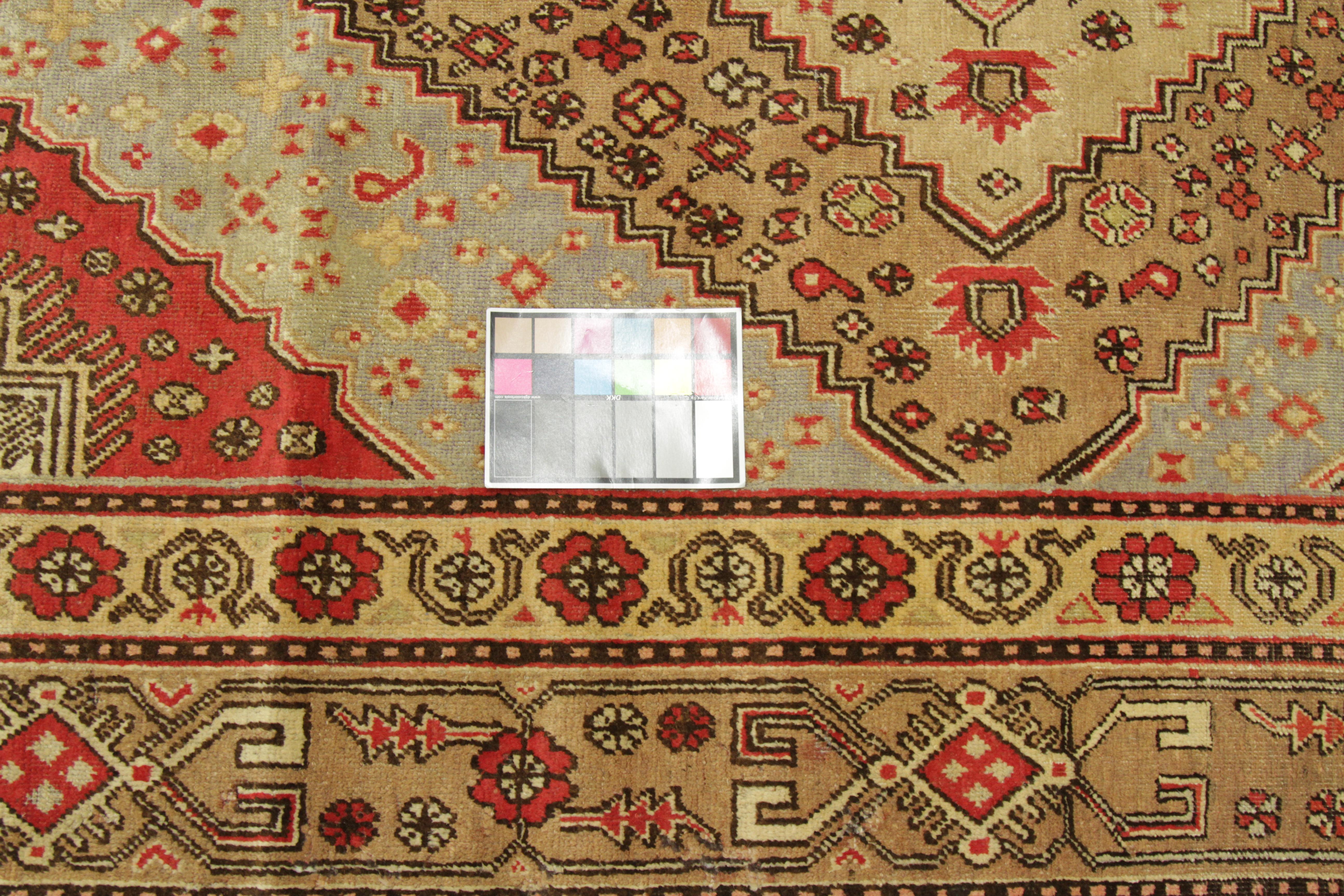 Hand-Knotted 1950s Antique Central Asian Rug Khotan Style with Elaborate Floral Motif For Sale